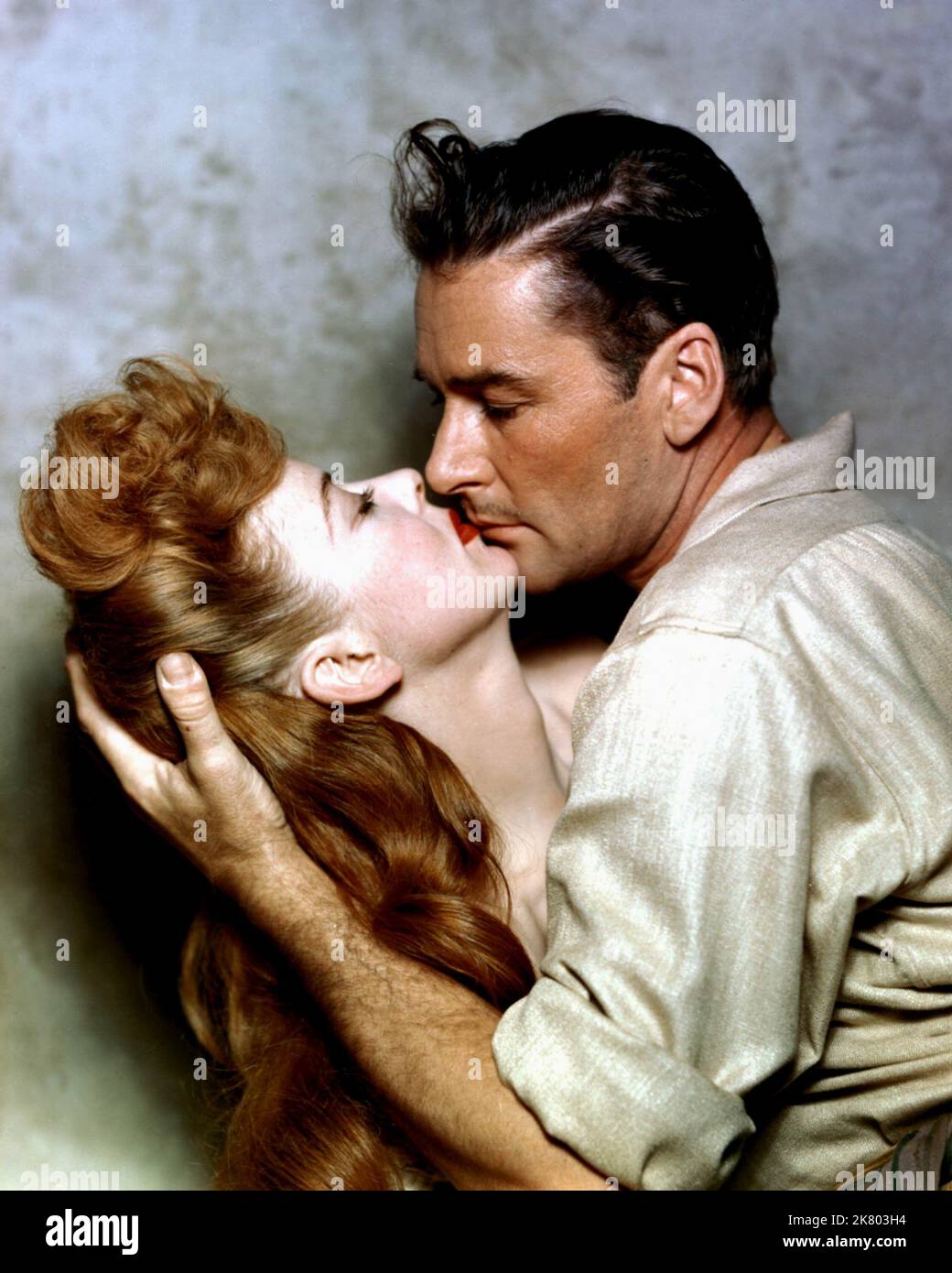 Maureen O'Hara & Errol Flynn Film: Against All Flags (USA 1952) Characters: & Brian Hawke  Director: George Sherman 21 November 1952   **WARNING** This Photograph is for editorial use only and is the copyright of UNIVERSAL and/or the Photographer assigned by the Film or Production Company and can only be reproduced by publications in conjunction with the promotion of the above Film. A Mandatory Credit To UNIVERSAL is required. The Photographer should also be credited when known. No commercial use can be granted without written authority from the Film Company. Stock Photo