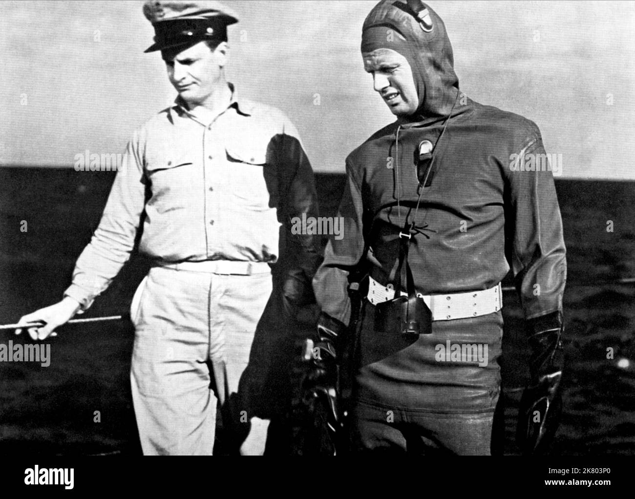 Robert Rockwell & Richard Widmark Film: The Frogmen (USA 1951) Characters: Lt. Bill Doyle & Lt. Cmdr. John Lawrence  Director: Lloyd Bacon 24 May 1951   **WARNING** This Photograph is for editorial use only and is the copyright of 20TH CENTURY FOX and/or the Photographer assigned by the Film or Production Company and can only be reproduced by publications in conjunction with the promotion of the above Film. A Mandatory Credit To 20TH CENTURY FOX is required. The Photographer should also be credited when known. No commercial use can be granted without written authority from the Film Company. Stock Photo