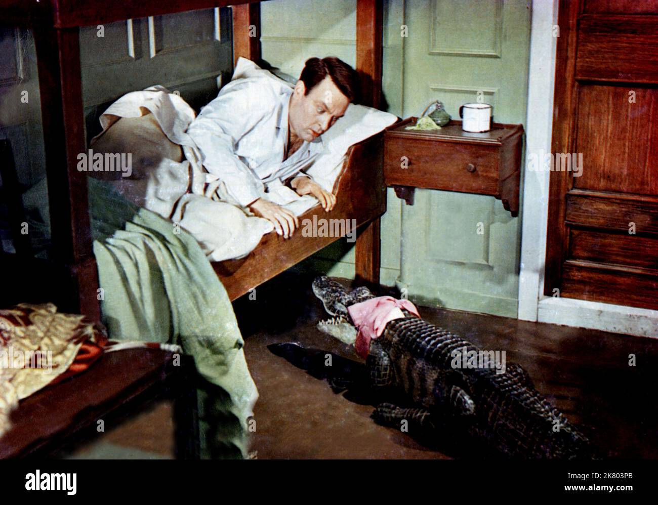 Donald Sinden Film: An Alligator Named Daisy (1955) Characters: Peter Weston  Director: J. Lee Thompson 29 June 1955   **WARNING** This Photograph is for editorial use only and is the copyright of THE RANK ORGANISATION and/or the Photographer assigned by the Film or Production Company and can only be reproduced by publications in conjunction with the promotion of the above Film. A Mandatory Credit To THE RANK ORGANISATION is required. The Photographer should also be credited when known. No commercial use can be granted without written authority from the Film Company. Stock Photo