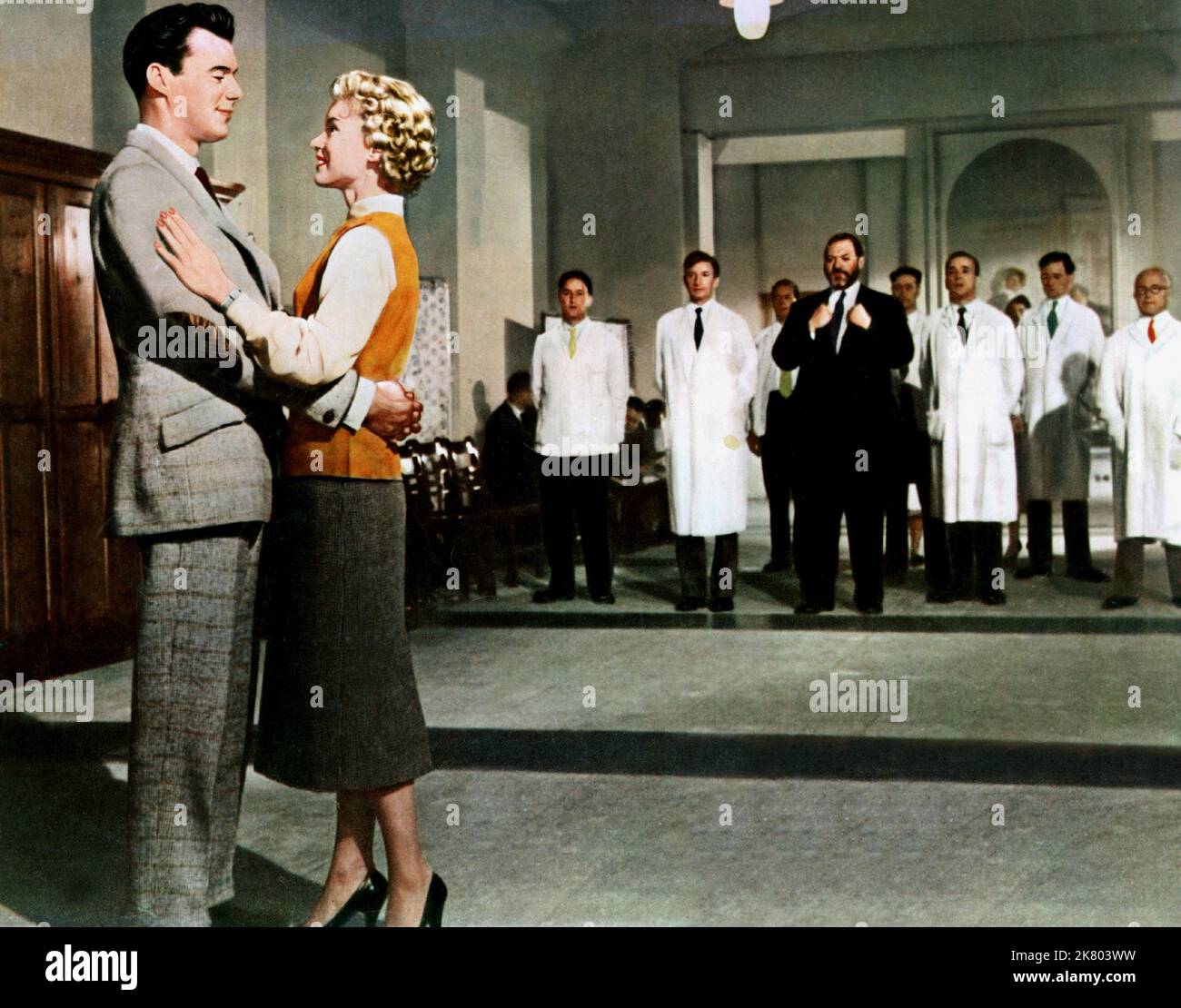 Dirk Bogarde, Muriel Pavlow & James Robertson Justice Film: Doctor At Large (1957) Characters: Dr. Simon Sparrow,Joy Gibson & Sir Lancelot Spratt  Director: Ralph Thomas 29 April 1957   **WARNING** This Photograph is for editorial use only and is the copyright of RANK ORGANISATION and/or the Photographer assigned by the Film or Production Company and can only be reproduced by publications in conjunction with the promotion of the above Film. A Mandatory Credit To RANK ORGANISATION is required. The Photographer should also be credited when known. No commercial use can be granted without written Stock Photo