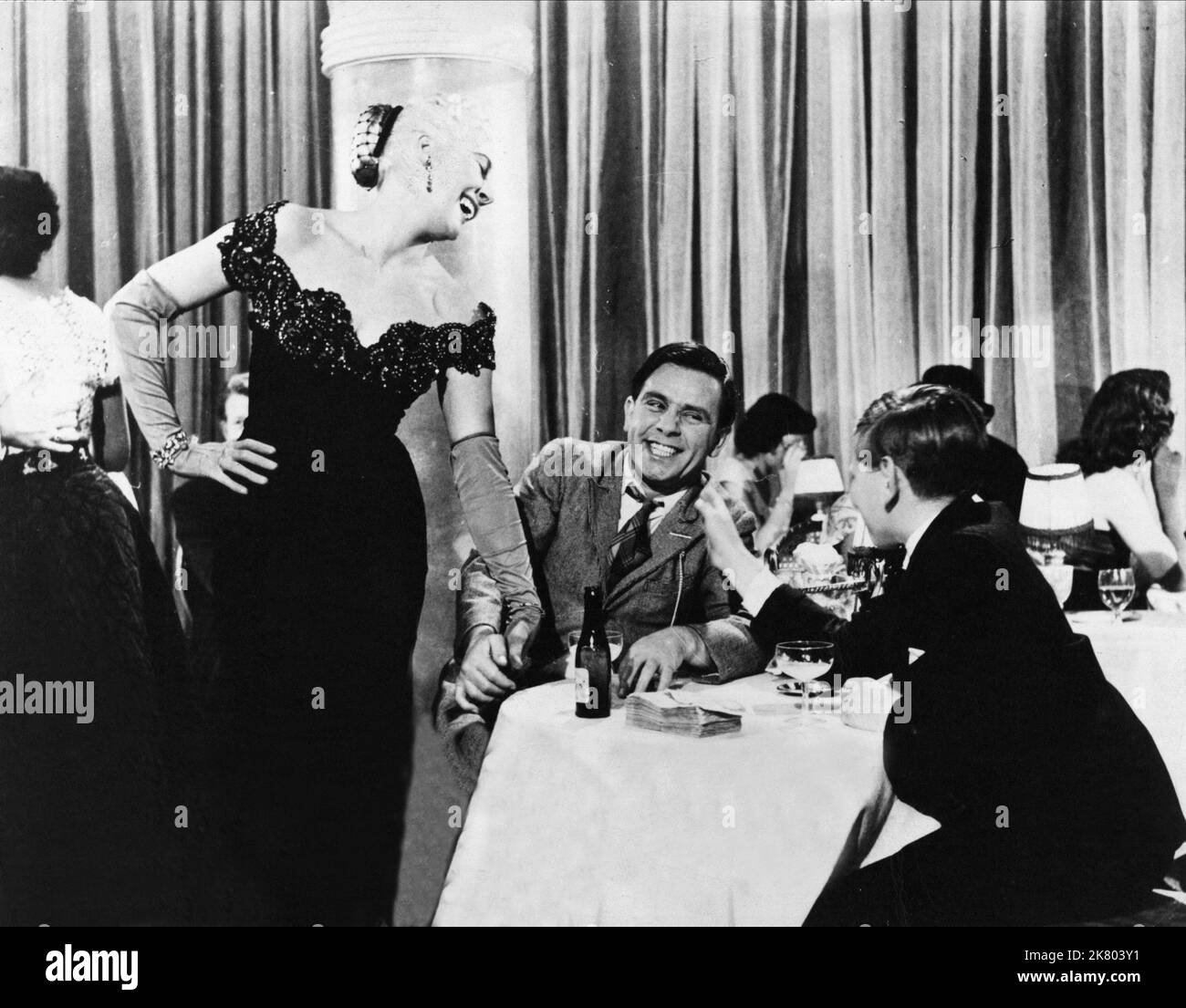 Norman Wisdom & Michael Caridia Film: Up In The World (GB 1956) Characters: Norman & Sir Reginald  Director: John Paddy Carstairs 06 December 1956   **WARNING** This Photograph is for editorial use only and is the copyright of RANK ORGANISATION and/or the Photographer assigned by the Film or Production Company and can only be reproduced by publications in conjunction with the promotion of the above Film. A Mandatory Credit To RANK ORGANISATION is required. The Photographer should also be credited when known. No commercial use can be granted without written authority from the Film Company. Stock Photo