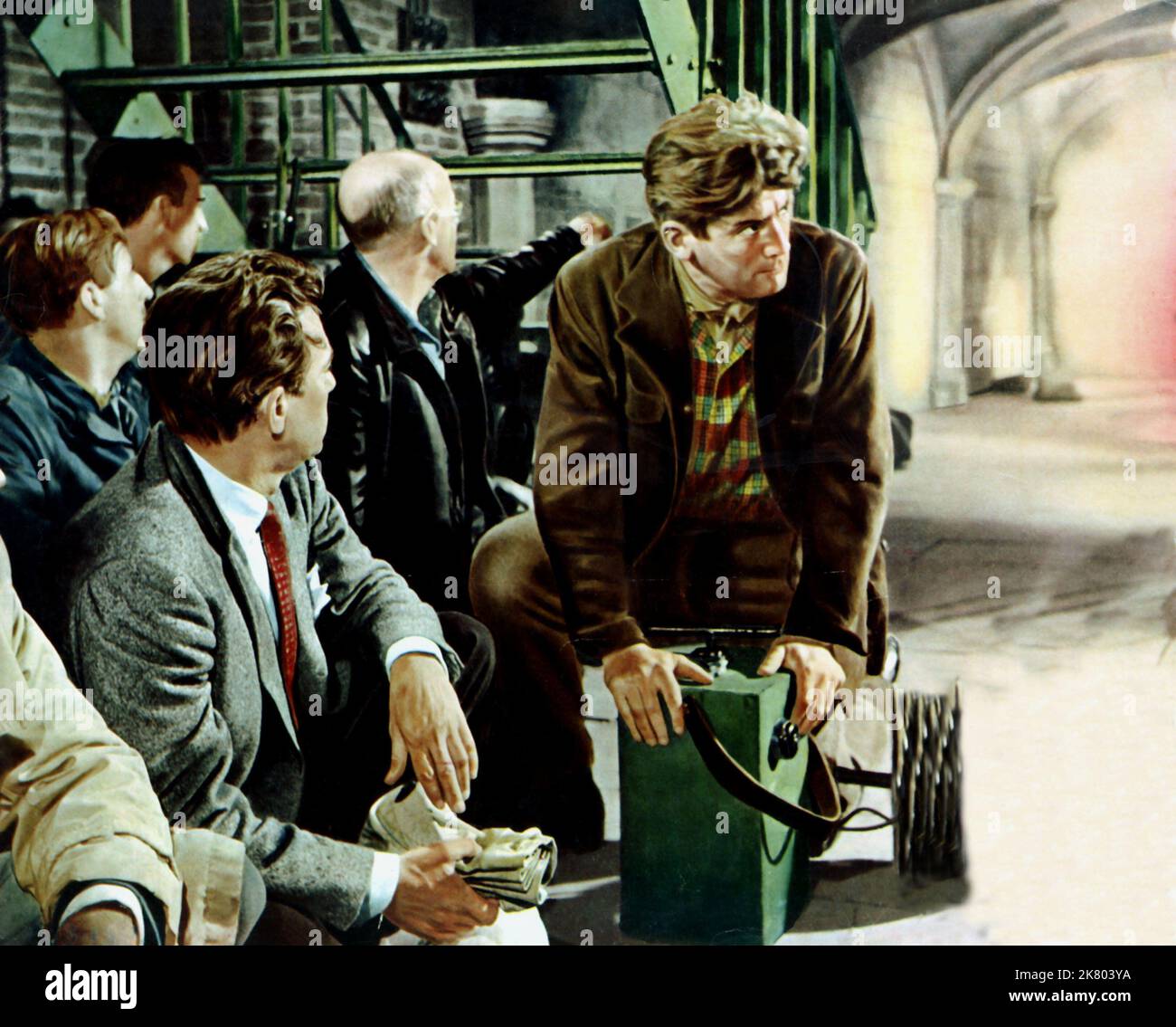 Peter Finch Film: Operation Amsterdam (UK 1959) Characters: WITH Jan Smit  Director: Michael Mccarthy 12 January 1959   **WARNING** This Photograph is for editorial use only and is the copyright of THE RANK ORGANISATION and/or the Photographer assigned by the Film or Production Company and can only be reproduced by publications in conjunction with the promotion of the above Film. A Mandatory Credit To THE RANK ORGANISATION is required. The Photographer should also be credited when known. No commercial use can be granted without written authority from the Film Company. Stock Photo