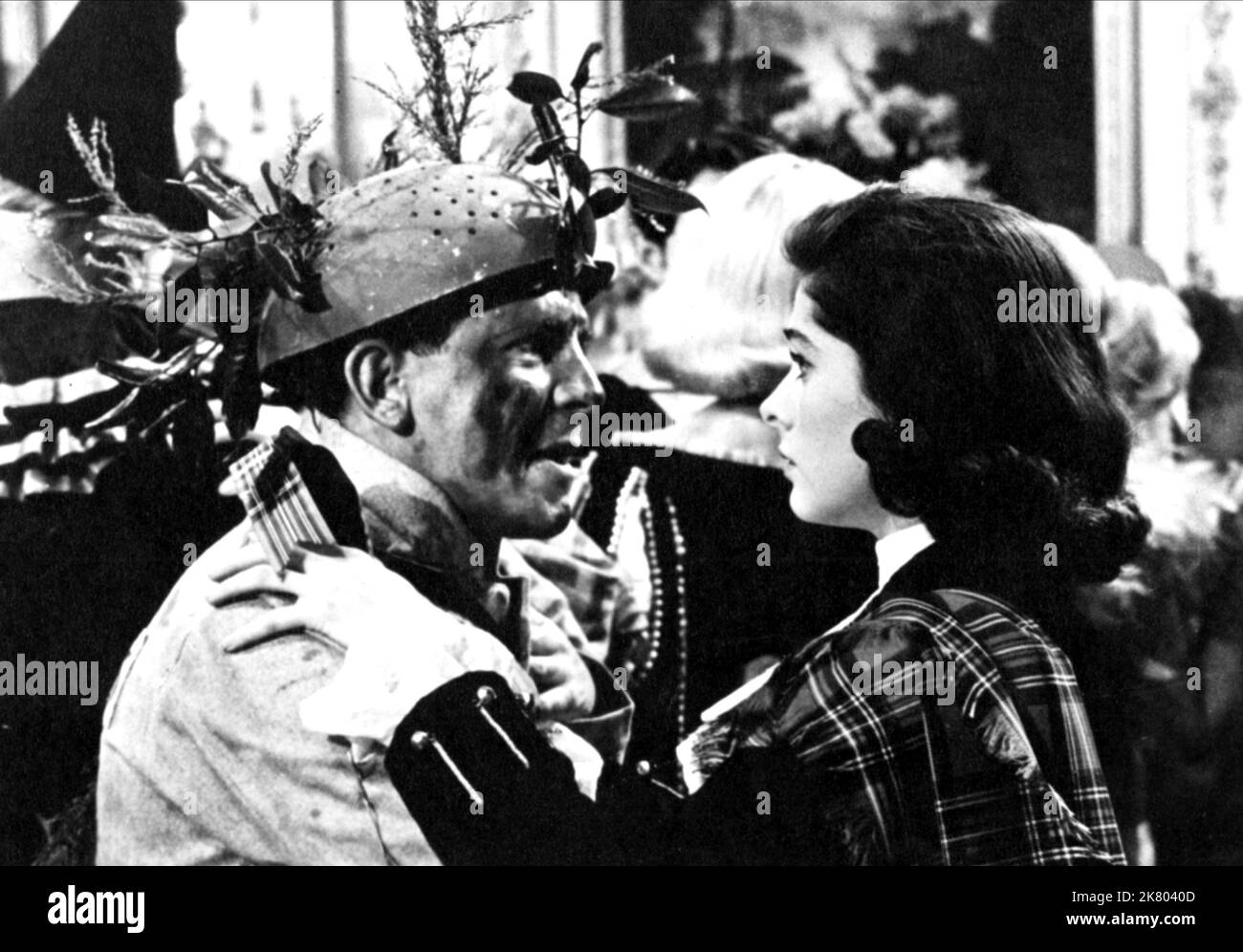 Norman Wisdom & Maureen Swanson Film: Up In The World (GB 1956) Characters: Norman & Jeannie Andrews  Director: John Paddy Carstairs 06 December 1956   **WARNING** This Photograph is for editorial use only and is the copyright of RANK ORGANISATION and/or the Photographer assigned by the Film or Production Company and can only be reproduced by publications in conjunction with the promotion of the above Film. A Mandatory Credit To RANK ORGANISATION is required. The Photographer should also be credited when known. No commercial use can be granted without written authority from the Film Company. Stock Photo