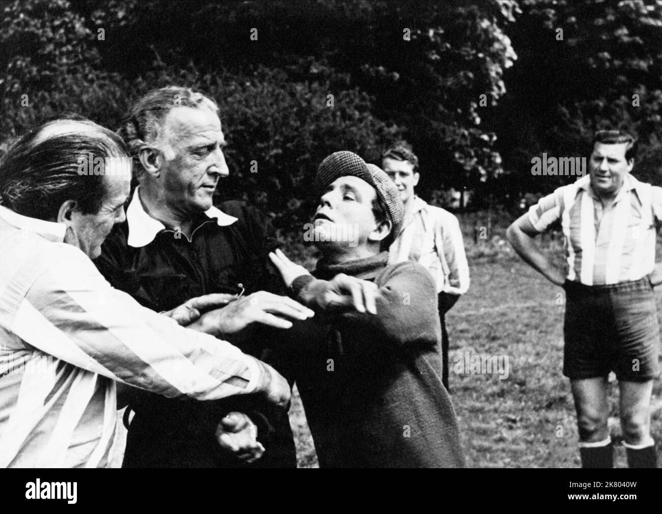 Jerry Desmonde & Norman Wisdom Film: Up In The World (GB 1956) Characters: Maj. Willoughby & Norman  Director: John Paddy Carstairs 06 December 1956   **WARNING** This Photograph is for editorial use only and is the copyright of RANK ORGANISATION and/or the Photographer assigned by the Film or Production Company and can only be reproduced by publications in conjunction with the promotion of the above Film. A Mandatory Credit To RANK ORGANISATION is required. The Photographer should also be credited when known. No commercial use can be granted without written authority from the Film Company. Stock Photo