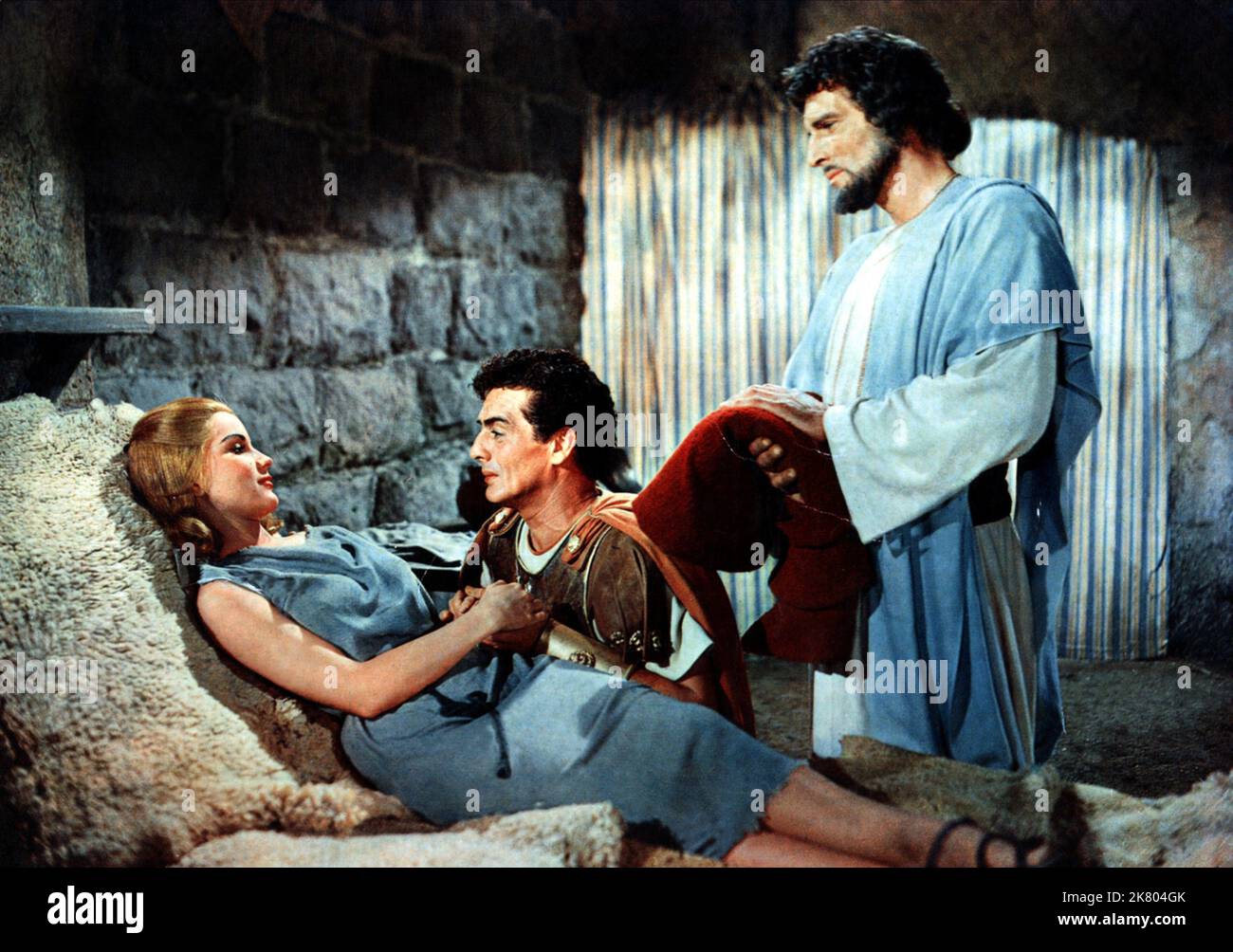 Debra Paget, Victor Mature & Michael Rennie Film: Demetrius And The Gladiators (USA 1954) Characters: Lucia,Demetrius & Peter  Director: Delmer Daves 16 June 1954   **WARNING** This Photograph is for editorial use only and is the copyright of 20TH CENTURY FOX and/or the Photographer assigned by the Film or Production Company and can only be reproduced by publications in conjunction with the promotion of the above Film. A Mandatory Credit To 20TH CENTURY FOX is required. The Photographer should also be credited when known. No commercial use can be granted without written authority from the Film Stock Photo
