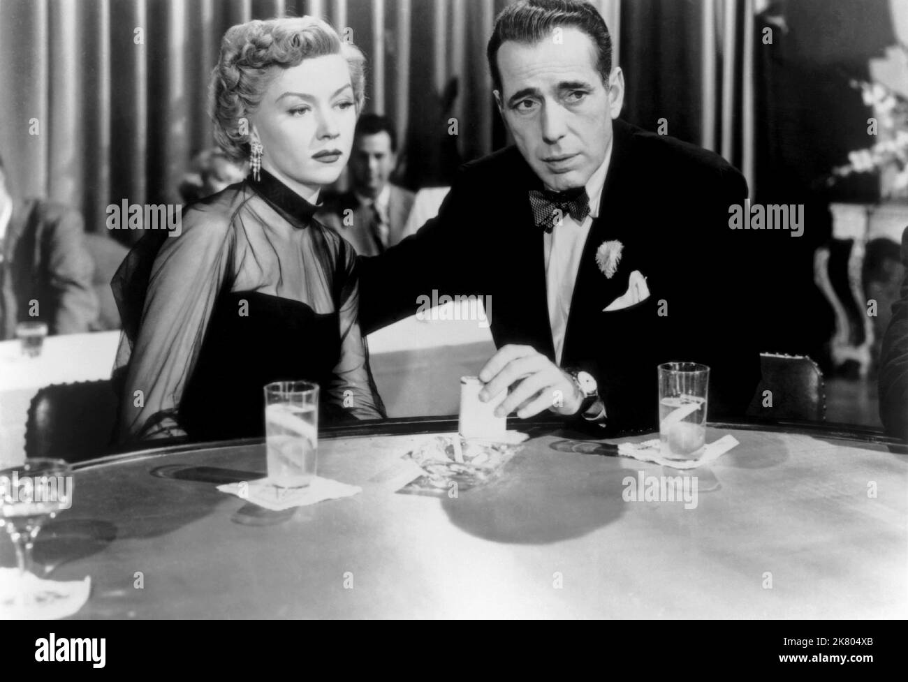 Jan Sterling & Humphrey Bogart Film: The Harder They Fall (1956) Characters: Beth Willis & Eddie Willis  Director: Mark Robson 01 April 1956   **WARNING** This Photograph is for editorial use only and is the copyright of COLUMBIA and/or the Photographer assigned by the Film or Production Company and can only be reproduced by publications in conjunction with the promotion of the above Film. A Mandatory Credit To COLUMBIA is required. The Photographer should also be credited when known. No commercial use can be granted without written authority from the Film Company. Stock Photo