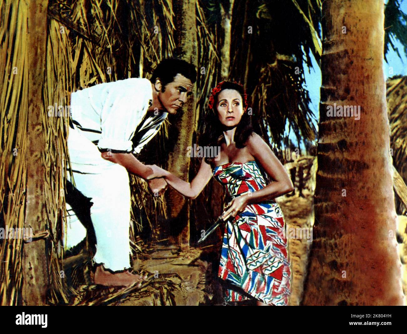 Dana Andrews & Jane Powell Film: Enchanted Island (USA 1958) Characters: Abner 'Ab' Bedford & Fayaway  / Literaturverfilmung Nach Dem Buch 'The Encantadas' (Based On The Book By Herman Melville) Director: Allan Dawn 08 November 1958   **WARNING** This Photograph is for editorial use only and is the copyright of BENEDICT BOGEAUS PRODUCTION and/or the Photographer assigned by the Film or Production Company and can only be reproduced by publications in conjunction with the promotion of the above Film. A Mandatory Credit To BENEDICT BOGEAUS PRODUCTION is required. The Photographer should also be c Stock Photo