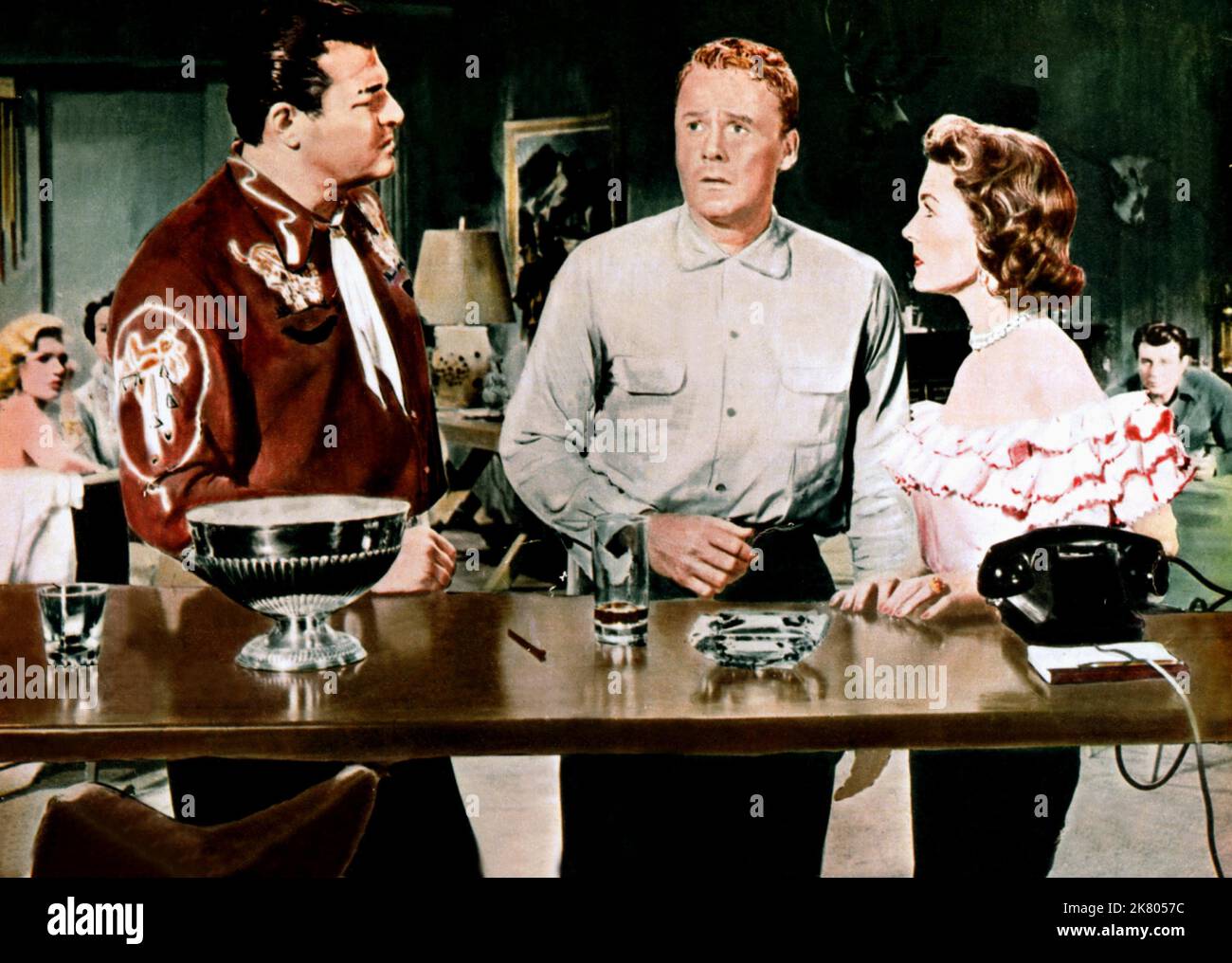 Jack Carson, Van Johnson & Margaret Hayes Film: Beyond The River; The Bottom Of The Bottle (1955) Characters: Hal Breckinridge,Donald Martin / Eric Bell & Lil Breckinridge  Director: Henry Hathaway 01 February 1956   **WARNING** This Photograph is for editorial use only and is the copyright of 20 CENTURY FOX and/or the Photographer assigned by the Film or Production Company and can only be reproduced by publications in conjunction with the promotion of the above Film. A Mandatory Credit To 20 CENTURY FOX is required. The Photographer should also be credited when known. No commercial use can be Stock Photo