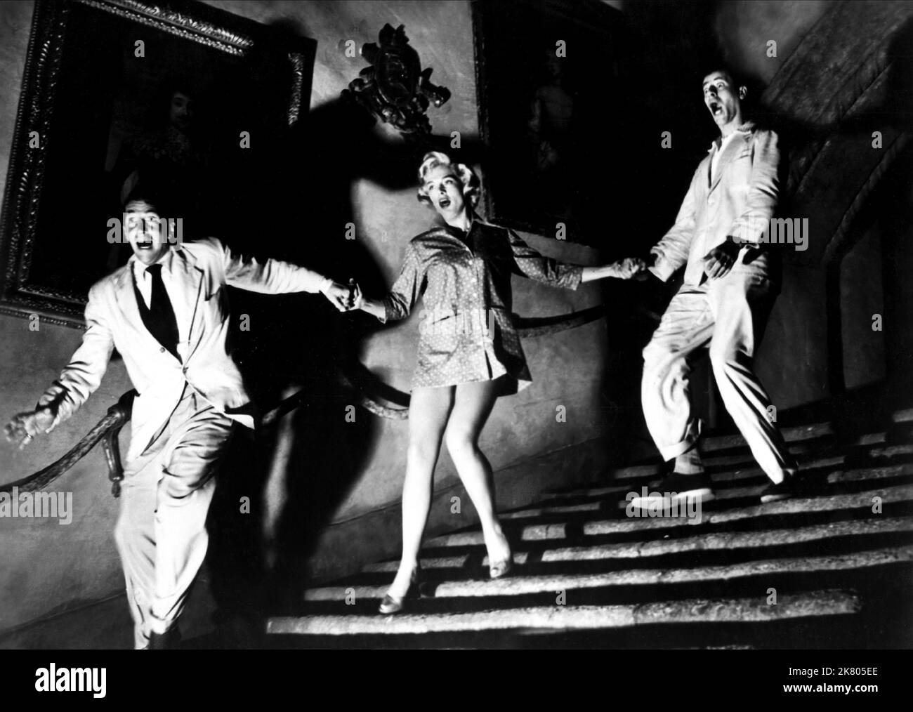 Dean Martin, Lizabeth Scott & Jerry Lewis Film: Scared Stiff (USA 1953) Characters: Larry Todd,Mary Carroll & Myron Mertz  Director: George Marshall 27 April 1953   **WARNING** This Photograph is for editorial use only and is the copyright of PARAMOUNT PICTURES and/or the Photographer assigned by the Film or Production Company and can only be reproduced by publications in conjunction with the promotion of the above Film. A Mandatory Credit To PARAMOUNT PICTURES is required. The Photographer should also be credited when known. No commercial use can be granted without written authority from the Stock Photo