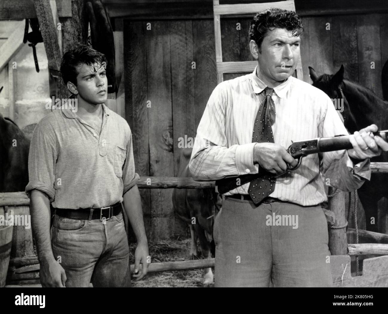 Claude Akins & Fabian Film: Hound-Dog Man (1959) Characters: Hog Peyson & Clint  Director: Don Siegel 01 November 1959   **WARNING** This Photograph is for editorial use only and is the copyright of 20TH CENTURY FOX and/or the Photographer assigned by the Film or Production Company and can only be reproduced by publications in conjunction with the promotion of the above Film. A Mandatory Credit To 20TH CENTURY FOX is required. The Photographer should also be credited when known. No commercial use can be granted without written authority from the Film Company. Stock Photo