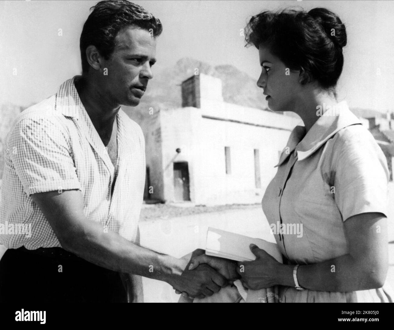 Renato Salvatori & Claudia Cardinale Film: Vento Del Sud; South Wind (1958) Characters: Antonio Spagara & Grazia Macri  Director: Enzo Provenzale 01 June 1959   **WARNING** This Photograph is for editorial use only and is the copyright of LUX FILM and/or the Photographer assigned by the Film or Production Company and can only be reproduced by publications in conjunction with the promotion of the above Film. A Mandatory Credit To LUX FILM is required. The Photographer should also be credited when known. No commercial use can be granted without written authority from the Film Company. Stock Photo