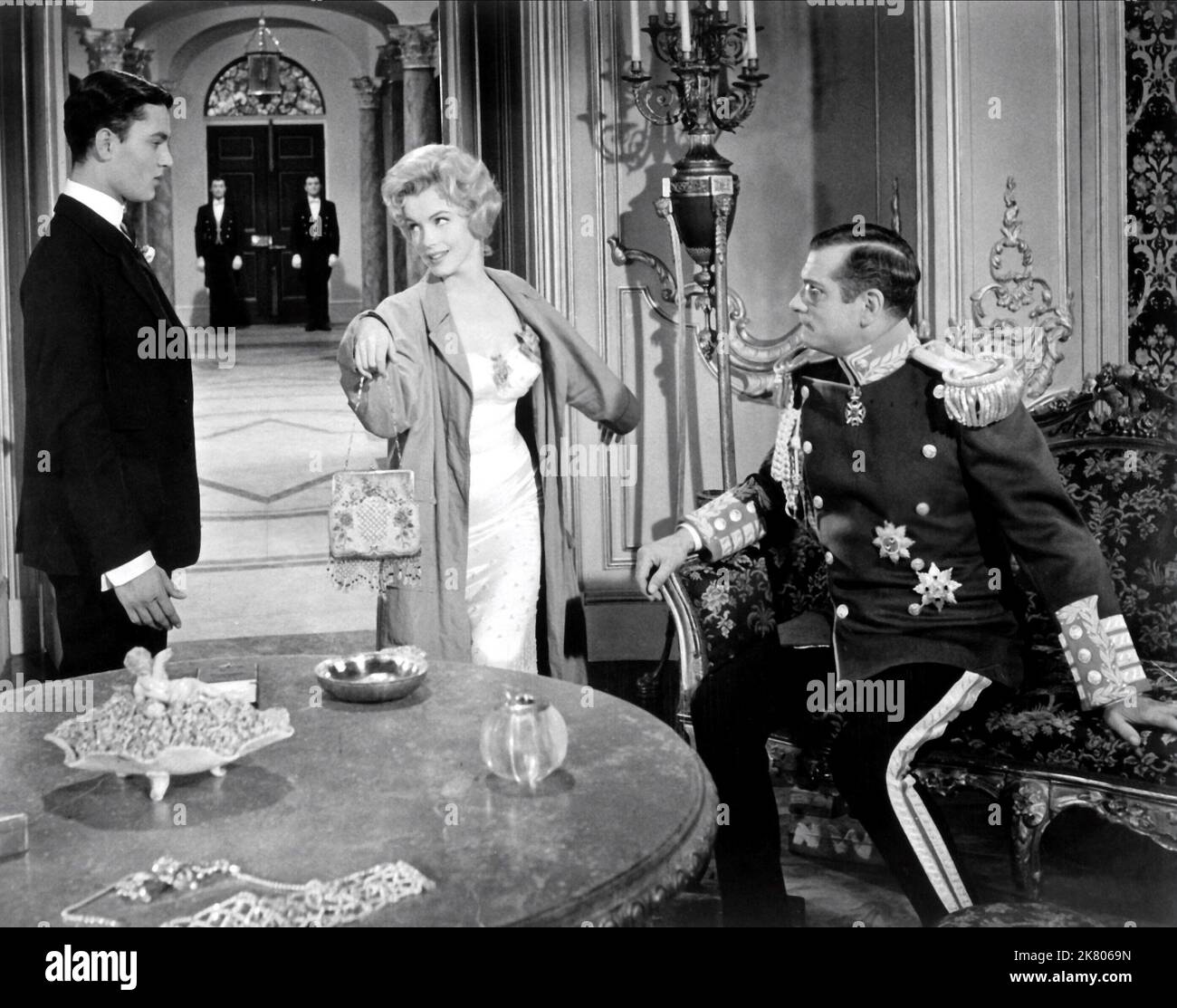 Jeremy Spenser, Laurence Olivier & Marilyn Monroe Film: The Prince And The Showgirl (USA/UK 1957) Characters: King Nicolas, Charles, the Prince Regent, Elsie Marina  Director: Laurence Olivier 13 June 1957   **WARNING** This Photograph is for editorial use only and is the copyright of WARNER BROS. and/or the Photographer assigned by the Film or Production Company and can only be reproduced by publications in conjunction with the promotion of the above Film. A Mandatory Credit To WARNER BROS. is required. The Photographer should also be credited when known. No commercial use can be granted with Stock Photo