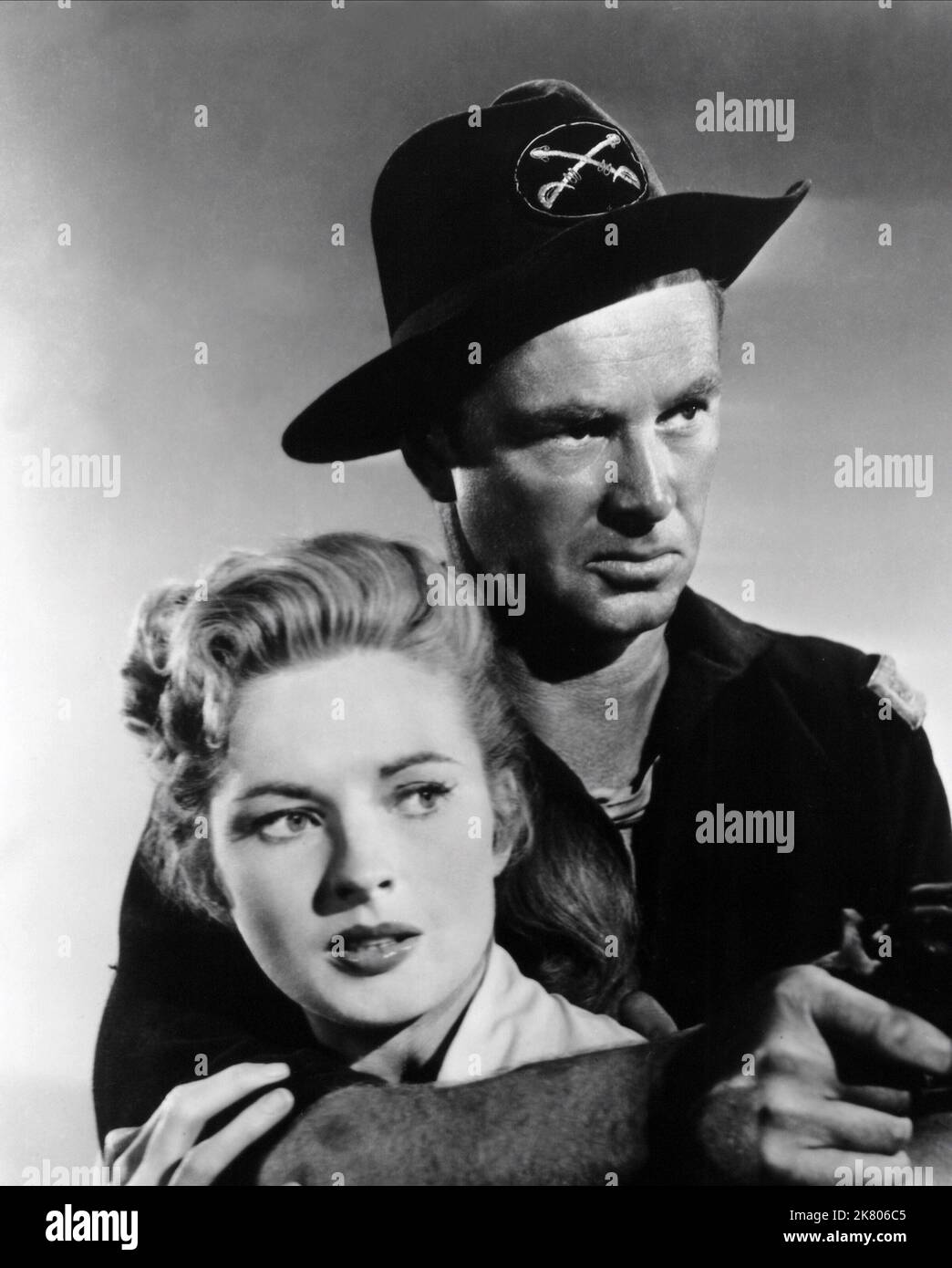 Coleen Gray & Sterling Hayden Film: Arrow In The Dust (USA 1954) Characters: Christella Burke, Bart Laish  Director: Lesley Selander 25 April 1954   **WARNING** This Photograph is for editorial use only and is the copyright of ALLIED ARTISTS and/or the Photographer assigned by the Film or Production Company and can only be reproduced by publications in conjunction with the promotion of the above Film. A Mandatory Credit To ALLIED ARTISTS is required. The Photographer should also be credited when known. No commercial use can be granted without written authority from the Film Company. Stock Photo