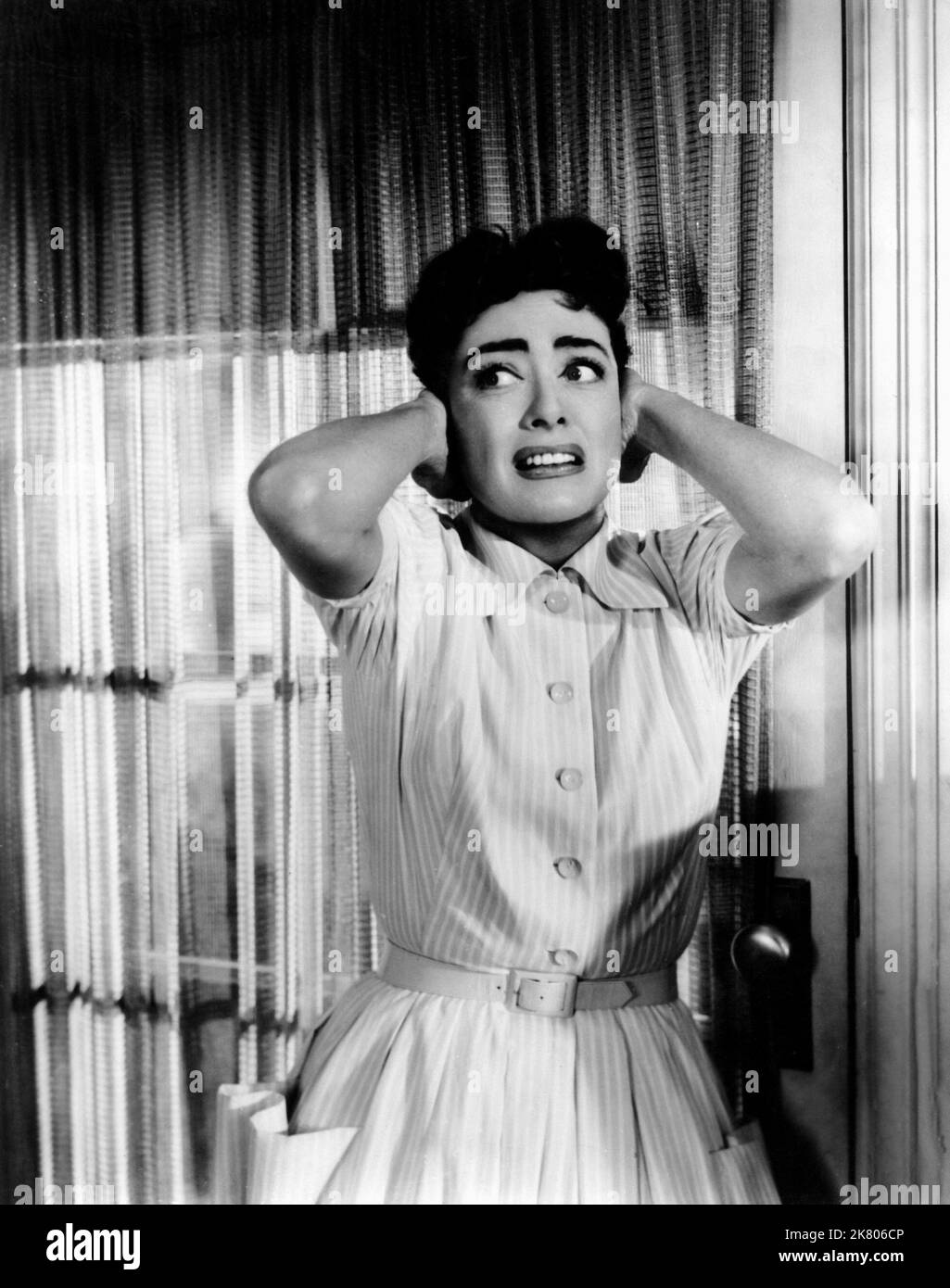 Joan Crawford Film: Autumn Leaves (USA 1956)   Director: Robert Aldrich 04 June 1956   **WARNING** This Photograph is for editorial use only and is the copyright of COLUMBIA and/or the Photographer assigned by the Film or Production Company and can only be reproduced by publications in conjunction with the promotion of the above Film. A Mandatory Credit To COLUMBIA is required. The Photographer should also be credited when known. No commercial use can be granted without written authority from the Film Company. Stock Photo
