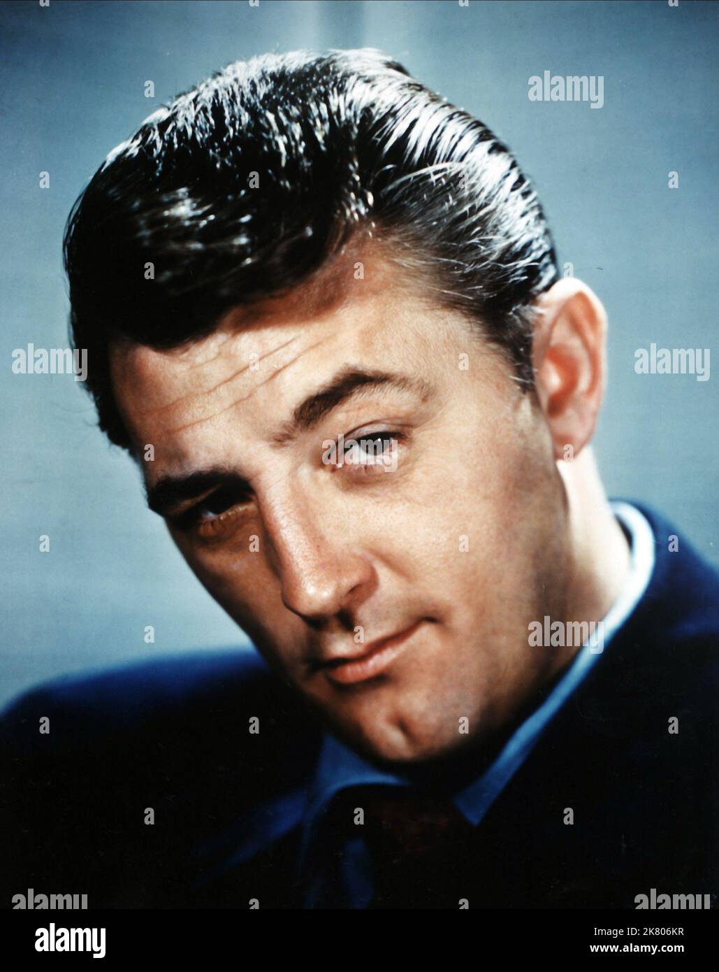 Robert Mitchum Film: Angel Face (1952) Characters: Frank Jessup  Director: Otto Preminger 11 December 1952   **WARNING** This Photograph is for editorial use only and is the copyright of RKO and/or the Photographer assigned by the Film or Production Company and can only be reproduced by publications in conjunction with the promotion of the above Film. A Mandatory Credit To RKO is required. The Photographer should also be credited when known. No commercial use can be granted without written authority from the Film Company. Stock Photo