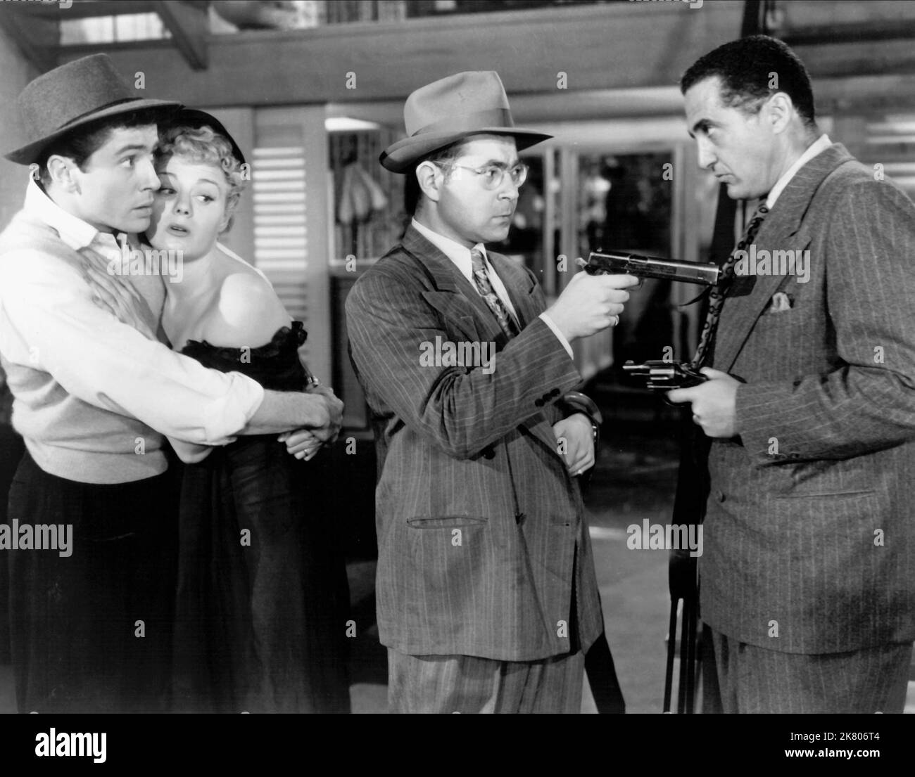 Farley Granger, Shelley Winters, Glenn Anders & Sheldon Leonard Film: Behave Yourself! (1955) Characters: William Calhoun 'Bill' Denny, Kate Denny, Pete the Pusher, Shortwave Bert  Director: George Beck 03 September 1951   **WARNING** This Photograph is for editorial use only and is the copyright of RKO RADIO PICTURES and/or the Photographer assigned by the Film or Production Company and can only be reproduced by publications in conjunction with the promotion of the above Film. A Mandatory Credit To RKO RADIO PICTURES is required. The Photographer should also be credited when known. No commerc Stock Photo