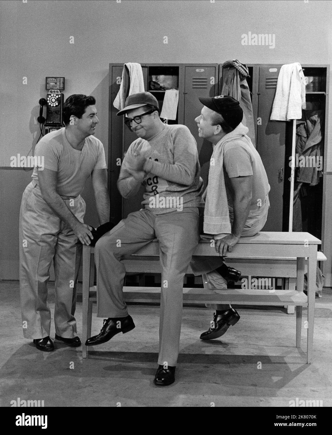 Harvey Lembeck, Phil Silvers & Allan Melvin Television: The Phil Silvers Show; Sergeant Bilko (TV-Serie) Characters: Cpl. Rocco Barbella, MSgt. Ernest G. Bilko, Cpl. Steve Henshaw  Usa 1955-1959, 20 September 1955   **WARNING** This Photograph is for editorial use only and is the copyright of CBS and/or the Photographer assigned by the Film or Production Company and can only be reproduced by publications in conjunction with the promotion of the above Film. A Mandatory Credit To CBS is required. The Photographer should also be credited when known. No commercial use can be granted without writte Stock Photo