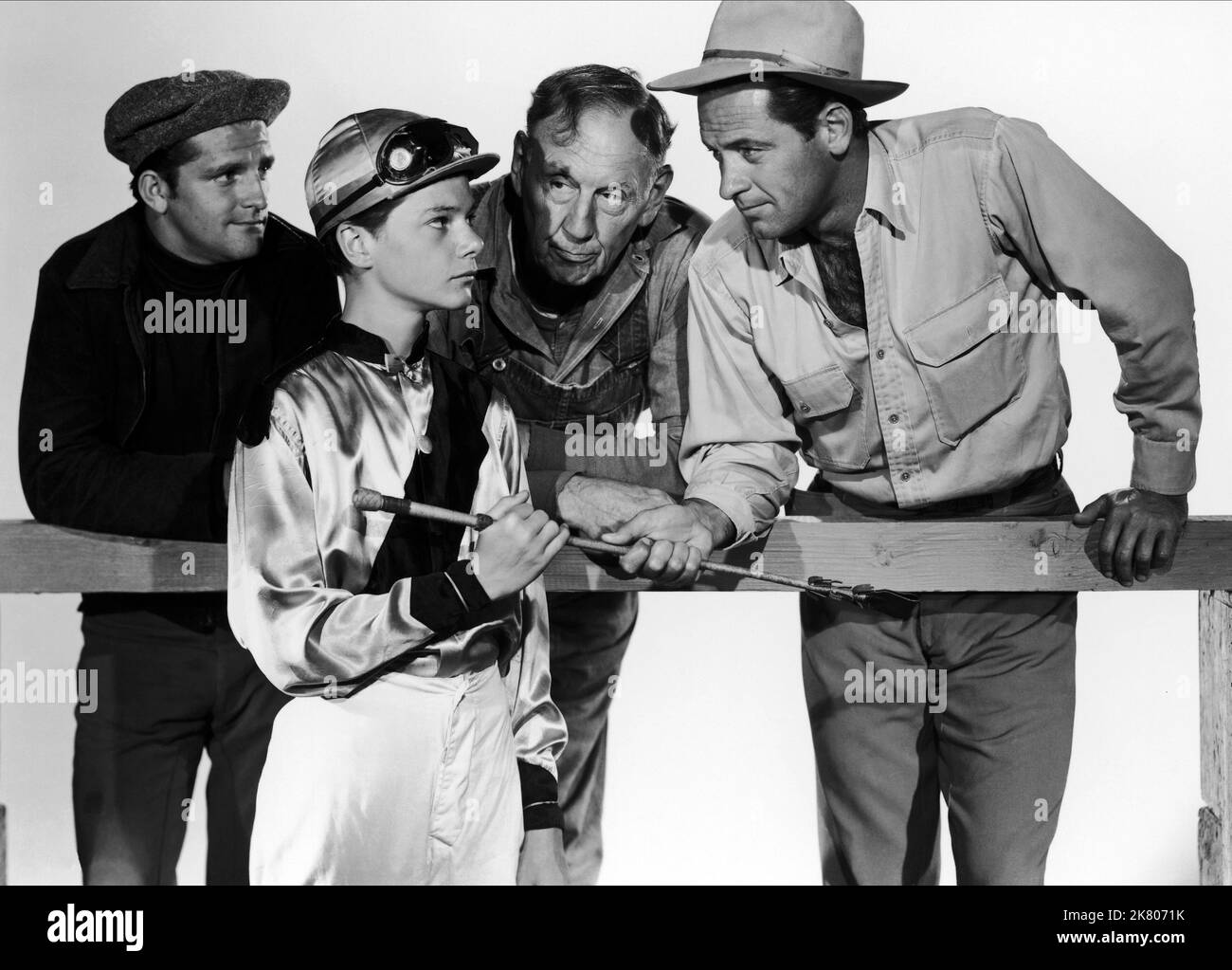 Stanley Clements, Johnny Stewart, Basil Ruysdael & William Holden Film: Boots Malone (1957) Characters: Stash Clements, Thomas Gibson Jr. aka The Kid, Preacher Cole, Boots Malone  Director: William Dieterle 11 January 1952   **WARNING** This Photograph is for editorial use only and is the copyright of COLUMBIA and/or the Photographer assigned by the Film or Production Company and can only be reproduced by publications in conjunction with the promotion of the above Film. A Mandatory Credit To COLUMBIA is required. The Photographer should also be credited when known. No commercial use can be gra Stock Photo