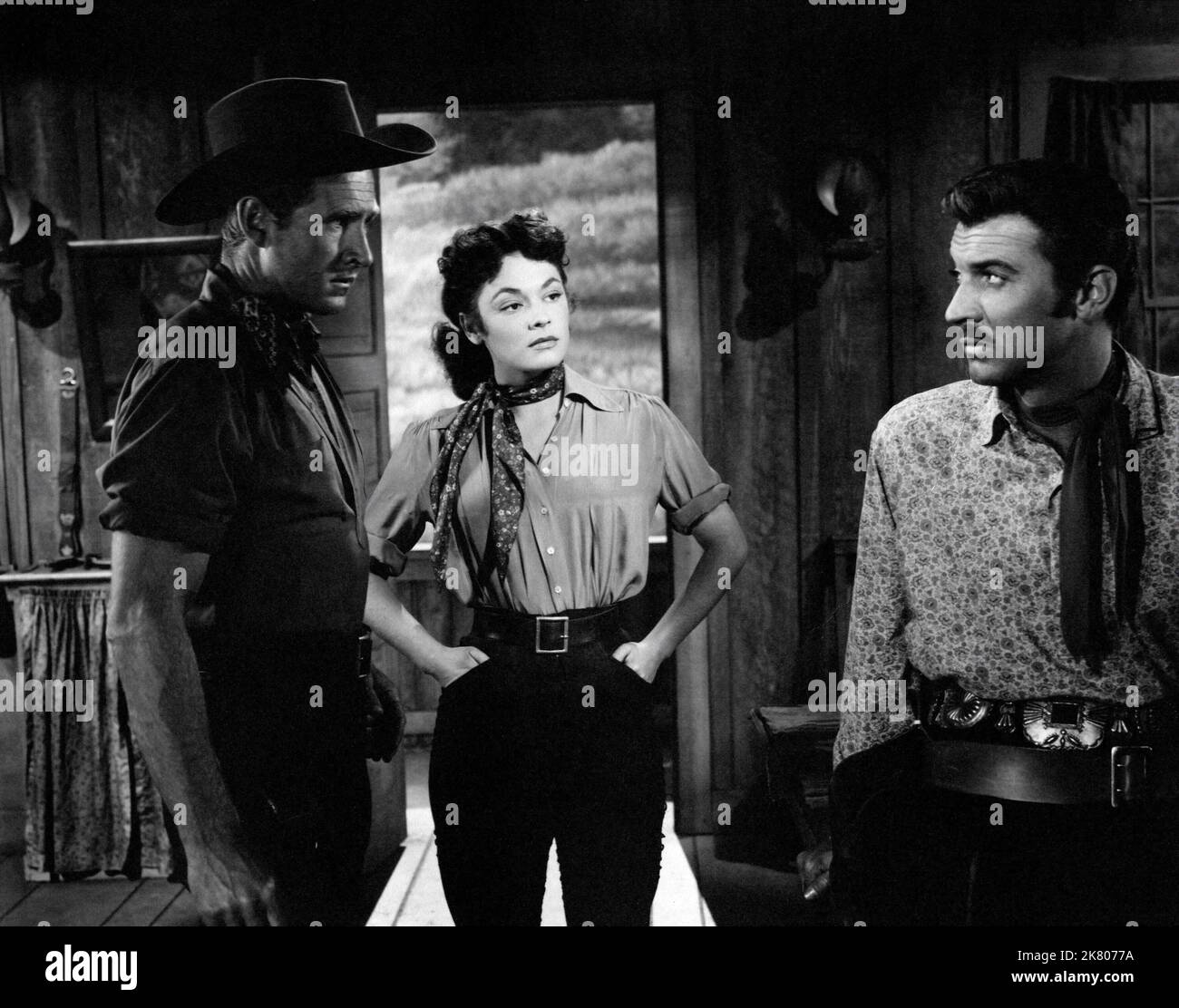 Lloyd Bridges, Ruth Roman & Zachary Scott Film: Colt .45 (1950) Characters: Paul Donovan, Beth Donovan, Jason Brett  Director: Edwin L. Marin 27 May 1950   **WARNING** This Photograph is for editorial use only and is the copyright of WARNER BROS and/or the Photographer assigned by the Film or Production Company and can only be reproduced by publications in conjunction with the promotion of the above Film. A Mandatory Credit To WARNER BROS is required. The Photographer should also be credited when known. No commercial use can be granted without written authority from the Film Company. Stock Photo