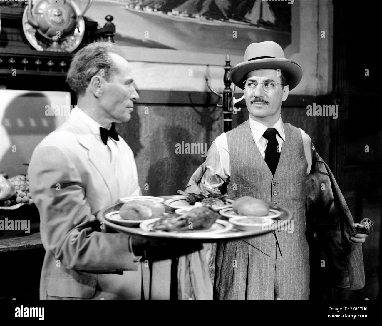 William Edmunds & Groucho Marx Film: Double Dynamite (1951) Characters: Mr. Baganucci, Emile J. Keck  Director: Irving Cummings 25 December 1951   **WARNING** This Photograph is for editorial use only and is the copyright of RKO and/or the Photographer assigned by the Film or Production Company and can only be reproduced by publications in conjunction with the promotion of the above Film. A Mandatory Credit To RKO is required. The Photographer should also be credited when known. No commercial use can be granted without written authority from the Film Company. Stock Photo