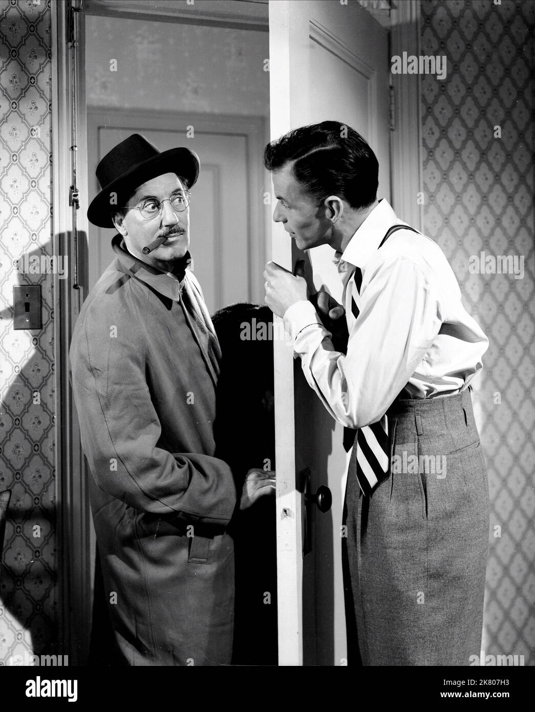 Groucho Marx & Frank Sinatra Film: Double Dynamite (1951) Characters: Emile J. Keck, Johnny Dalton  Director: Irving Cummings 25 December 1951   **WARNING** This Photograph is for editorial use only and is the copyright of RKO and/or the Photographer assigned by the Film or Production Company and can only be reproduced by publications in conjunction with the promotion of the above Film. A Mandatory Credit To RKO is required. The Photographer should also be credited when known. No commercial use can be granted without written authority from the Film Company. Stock Photo