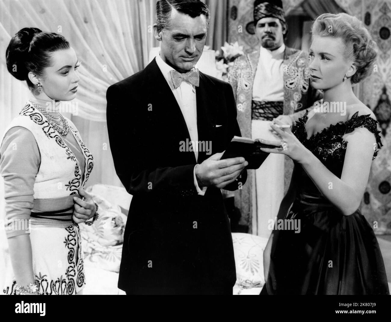 Betta St. John, Cary Grant & Deborah Kerr Film: Dream Wife (1953) Characters: Tarji, Clemson Reade, Effie  Director: Sidney Sheldon 09 December 1953   **WARNING** This Photograph is for editorial use only and is the copyright of MGM and/or the Photographer assigned by the Film or Production Company and can only be reproduced by publications in conjunction with the promotion of the above Film. A Mandatory Credit To MGM is required. The Photographer should also be credited when known. No commercial use can be granted without written authority from the Film Company. Stock Photo