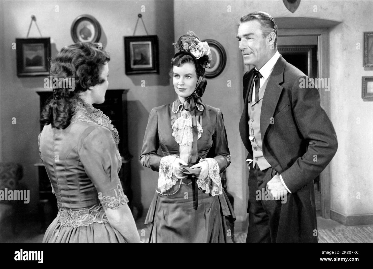 Phyllis Thaxter, Helena Carter & Randolph Scott Film: Fort Worth (1951) Characters: Flora Talbot, Amy Brooks, Ned Britt  Director: Edwin L. Marin 12 July 1951   **WARNING** This Photograph is for editorial use only and is the copyright of WARNER BRO and/or the Photographer assigned by the Film or Production Company and can only be reproduced by publications in conjunction with the promotion of the above Film. A Mandatory Credit To WARNER BRO is required. The Photographer should also be credited when known. No commercial use can be granted without written authority from the Film Company. Stock Photo