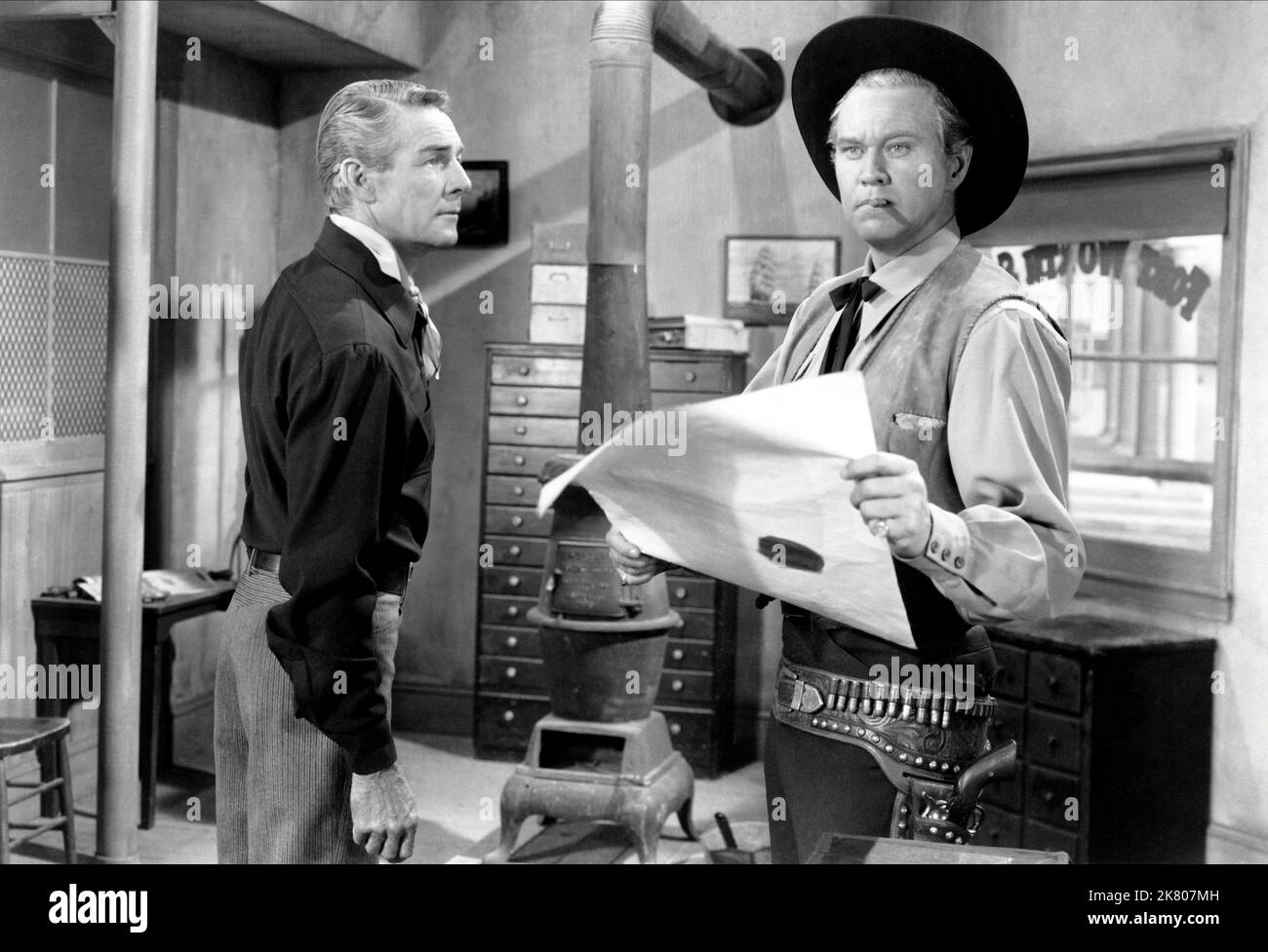 Randolph Scott & David Brian Film: Fort Worth (1951) Characters: Ned Britt, Blair Lunsford  Director: Edwin L. Marin 12 July 1951   **WARNING** This Photograph is for editorial use only and is the copyright of WARNER BRO and/or the Photographer assigned by the Film or Production Company and can only be reproduced by publications in conjunction with the promotion of the above Film. A Mandatory Credit To WARNER BRO is required. The Photographer should also be credited when known. No commercial use can be granted without written authority from the Film Company. Stock Photo
