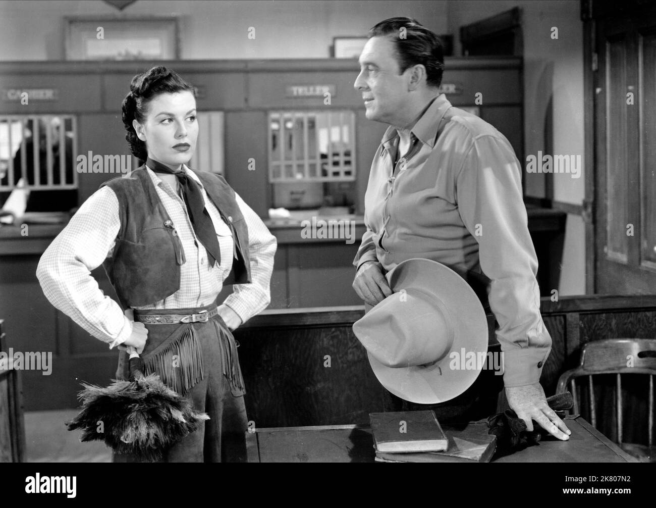 Sheila Ryan & George O'Brien Film: Gold Raiders; The Stooges Go West (USA 1951) Characters: Laura Mason, George O'Brien  Director: Edward Bernds 09 September 1951   **WARNING** This Photograph is for editorial use only and is the copyright of UNITED ARTISTS and/or the Photographer assigned by the Film or Production Company and can only be reproduced by publications in conjunction with the promotion of the above Film. A Mandatory Credit To UNITED ARTISTS is required. The Photographer should also be credited when known. No commercial use can be granted without written authority from the Film Com Stock Photo