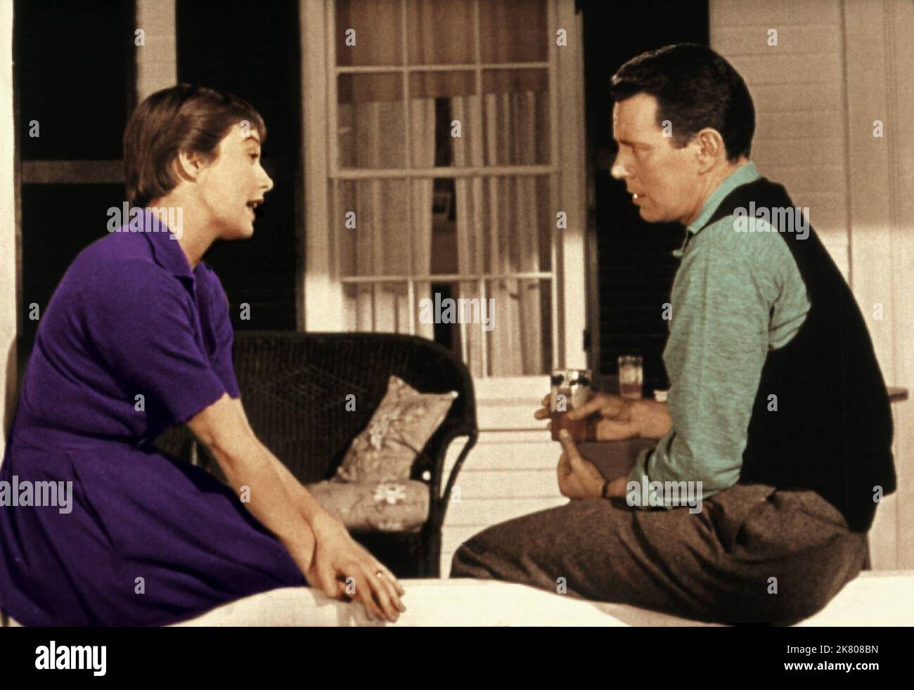 Shirley Maclaine & John Forsythe Film: The Trouble With Harry (USA 1955) Characters: Jennifer Rogers & Sam Marlowe  / Literaturverfilmung (Based On The Book By Jack Trevor Story) Director: Alfred Hitchcock 30 September 1955   **WARNING** This Photograph is for editorial use only and is the copyright of ALFRED J. HITCHCOCK PRODUCTIONS and/or the Photographer assigned by the Film or Production Company and can only be reproduced by publications in conjunction with the promotion of the above Film. A Mandatory Credit To ALFRED J. HITCHCOCK PRODUCTIONS is required. The Photographer should also be cr Stock Photo