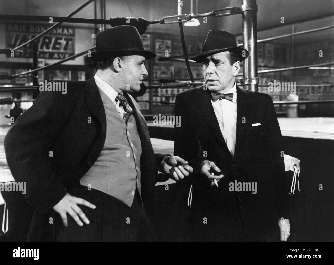 Scene With Humphrey Bogart Film: The Harder They Fall (1956) Characters: WITH Eddie Willis  Director: Mark Robson 01 April 1956   **WARNING** This Photograph is for editorial use only and is the copyright of COLUMBIA and/or the Photographer assigned by the Film or Production Company and can only be reproduced by publications in conjunction with the promotion of the above Film. A Mandatory Credit To COLUMBIA is required. The Photographer should also be credited when known. No commercial use can be granted without written authority from the Film Company. Stock Photo
