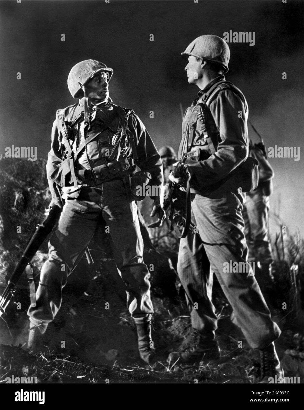 Woody Strode & Gregory Peck Film: Pork Chop Hill (1950) Characters: Pvt. Franklin & Lt. Joe Clemons  Director: Lewis Milestone 29 May 1959   **WARNING** This Photograph is for editorial use only and is the copyright of UNITED ARTISTS and/or the Photographer assigned by the Film or Production Company and can only be reproduced by publications in conjunction with the promotion of the above Film. A Mandatory Credit To UNITED ARTISTS is required. The Photographer should also be credited when known. No commercial use can be granted without written authority from the Film Company. Stock Photo