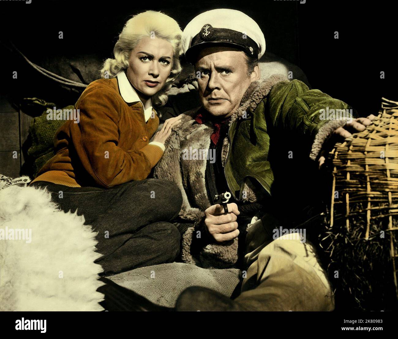 Martine Carol & Van Johnson Film: Action Of The Tiger (UK/USA 1957) Characters: Tracy Malvoisie & Carson  Director: Terence Young 22 August 1957   **WARNING** This Photograph is for editorial use only and is the copyright of CLARIDGE PRODUCTIONS and/or the Photographer assigned by the Film or Production Company and can only be reproduced by publications in conjunction with the promotion of the above Film. A Mandatory Credit To CLARIDGE PRODUCTIONS is required. The Photographer should also be credited when known. No commercial use can be granted without written authority from the Film Company. Stock Photo
