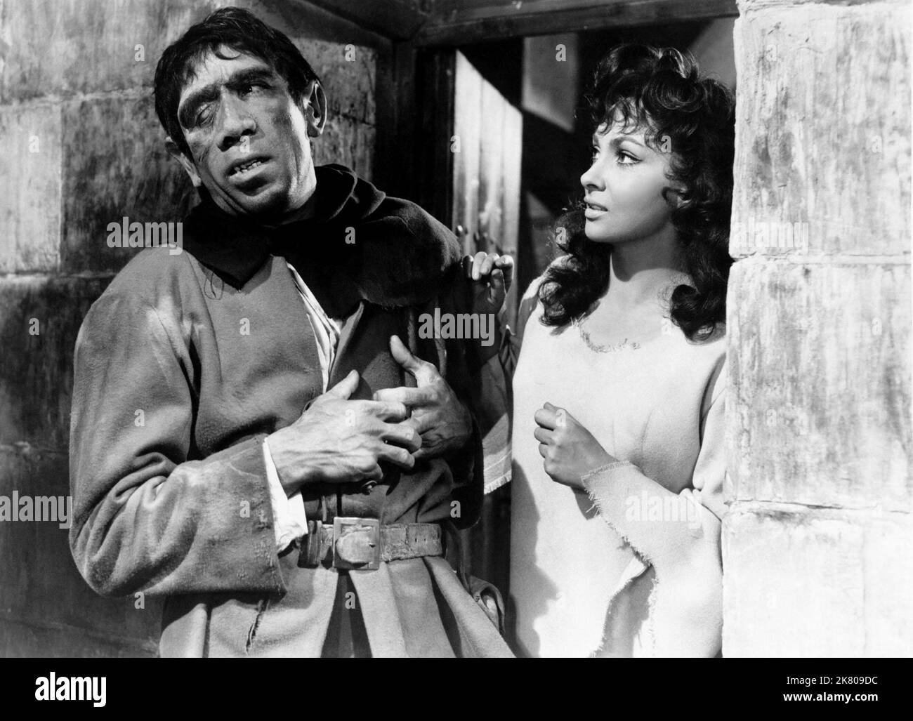 Anthony Quinn & Gina Lollobrigida Film: Notre Dame De Paris; The Hunchback Of Notre Dame (1957) Characters: Quasimodo & Esmeralda  Director: Jean Delannoy 19 December 1956   **WARNING** This Photograph is for editorial use only and is the copyright of ALLIED ARTISTS and/or the Photographer assigned by the Film or Production Company and can only be reproduced by publications in conjunction with the promotion of the above Film. A Mandatory Credit To ALLIED ARTISTS is required. The Photographer should also be credited when known. No commercial use can be granted without written authority from the Stock Photo