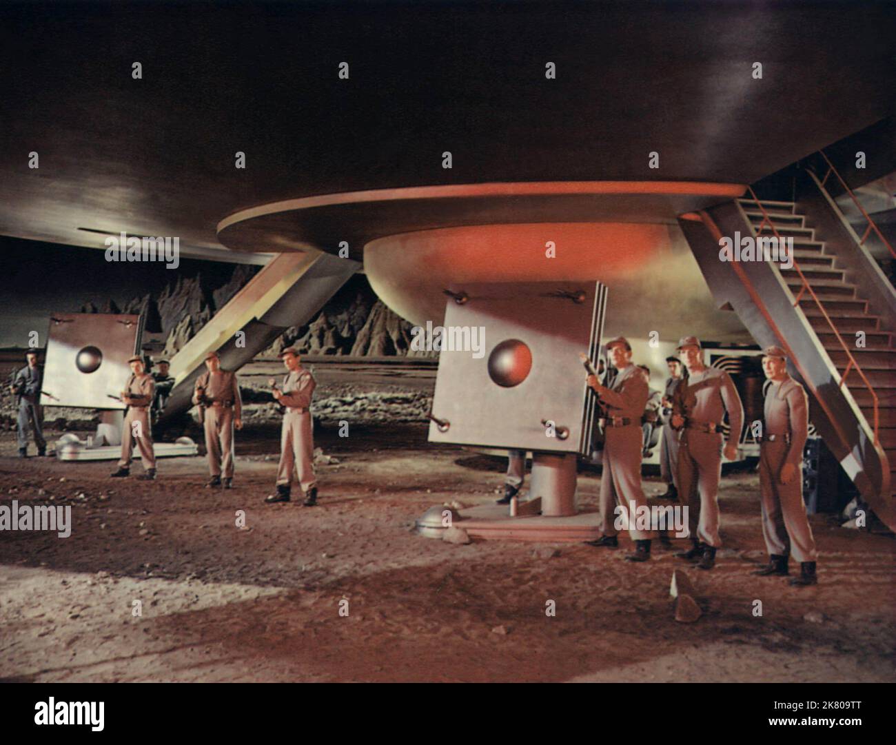 Crew And Spaceship Scene Film: Forbidden Planet (USA 1956)   Director: Fred M.Wilcox 23 March 1956   **WARNING** This Photograph is for editorial use only and is the copyright of MGM and/or the Photographer assigned by the Film or Production Company and can only be reproduced by publications in conjunction with the promotion of the above Film. A Mandatory Credit To MGM is required. The Photographer should also be credited when known. No commercial use can be granted without written authority from the Film Company. Stock Photo