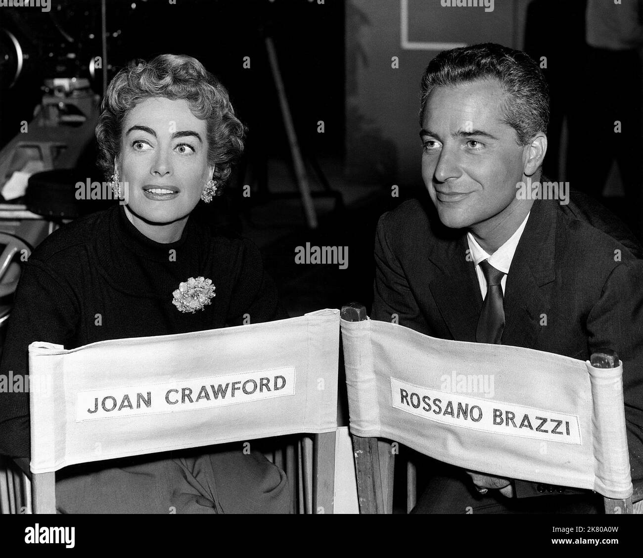 Joan Crawford & Rossano Brazzi Film: The Story Of Esther Costello (1953) Characters: Margaret Landi & Carlo Landi  06 November 1957   **WARNING** This Photograph is for editorial use only and is the copyright of COLUMBIA and/or the Photographer assigned by the Film or Production Company and can only be reproduced by publications in conjunction with the promotion of the above Film. A Mandatory Credit To COLUMBIA is required. The Photographer should also be credited when known. No commercial use can be granted without written authority from the Film Company. Stock Photo