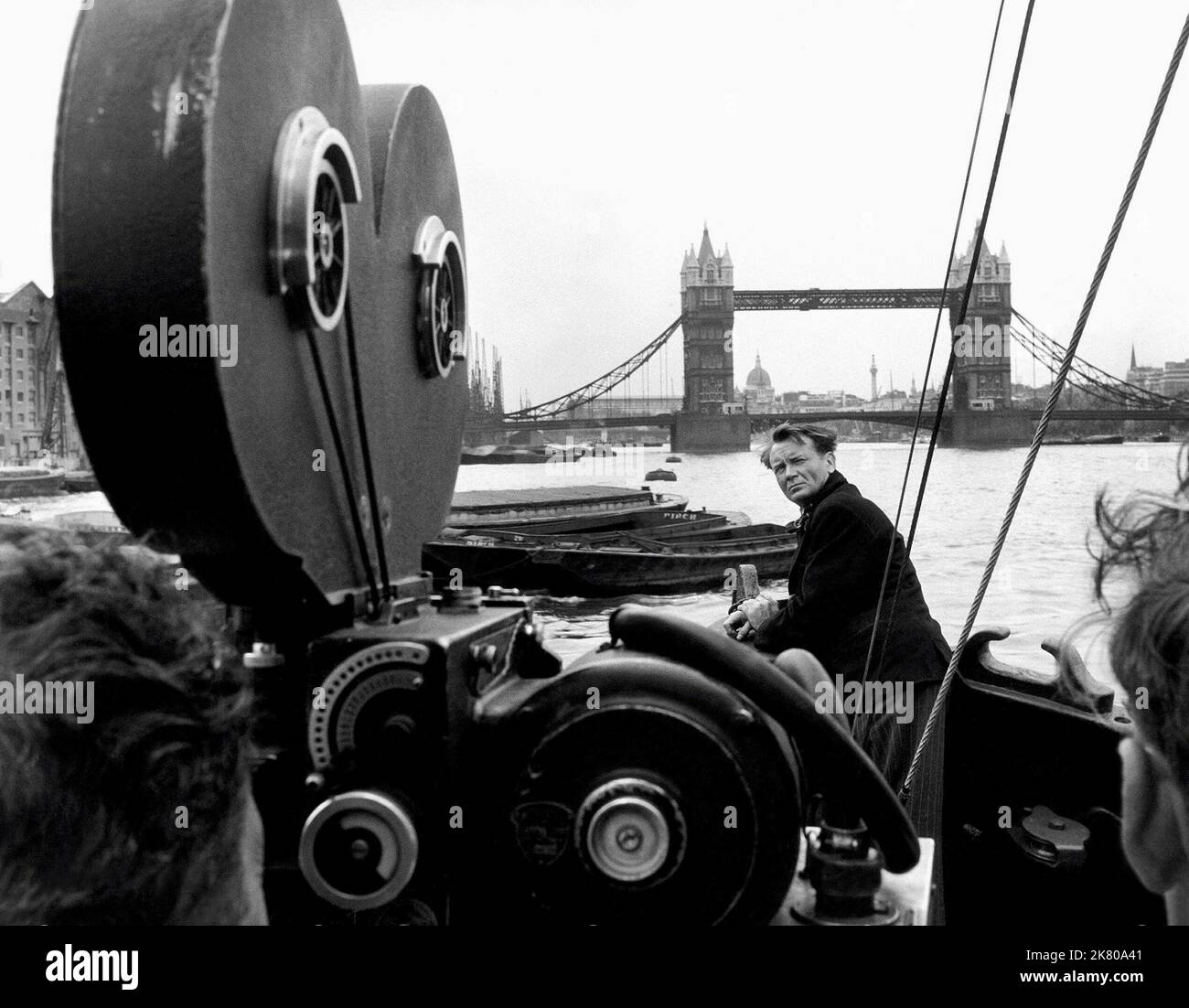 John Mills On The River Thames Film: The Long Memory (1959)   Director: Robert Hamer 11 October 1952   **WARNING** This Photograph is for editorial use only and is the copyright of RANK and/or the Photographer assigned by the Film or Production Company and can only be reproduced by publications in conjunction with the promotion of the above Film. A Mandatory Credit To RANK is required. The Photographer should also be credited when known. No commercial use can be granted without written authority from the Film Company. Stock Photo