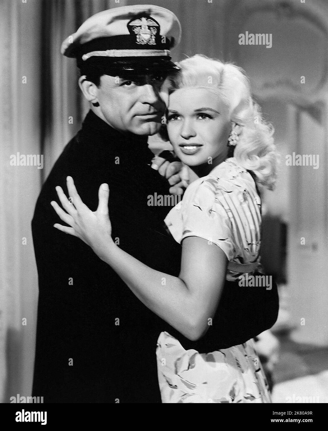 Cary Grant & Jayne Mansfield Film: Kiss Them For Me (1952) Characters: Cmdr. Andy Crewson & Alice Kratzner  Director: Stanley Donen 10 December 1957   **WARNING** This Photograph is for editorial use only and is the copyright of 20 CENTURY FOX and/or the Photographer assigned by the Film or Production Company and can only be reproduced by publications in conjunction with the promotion of the above Film. A Mandatory Credit To 20 CENTURY FOX is required. The Photographer should also be credited when known. No commercial use can be granted without written authority from the Film Company. Stock Photo