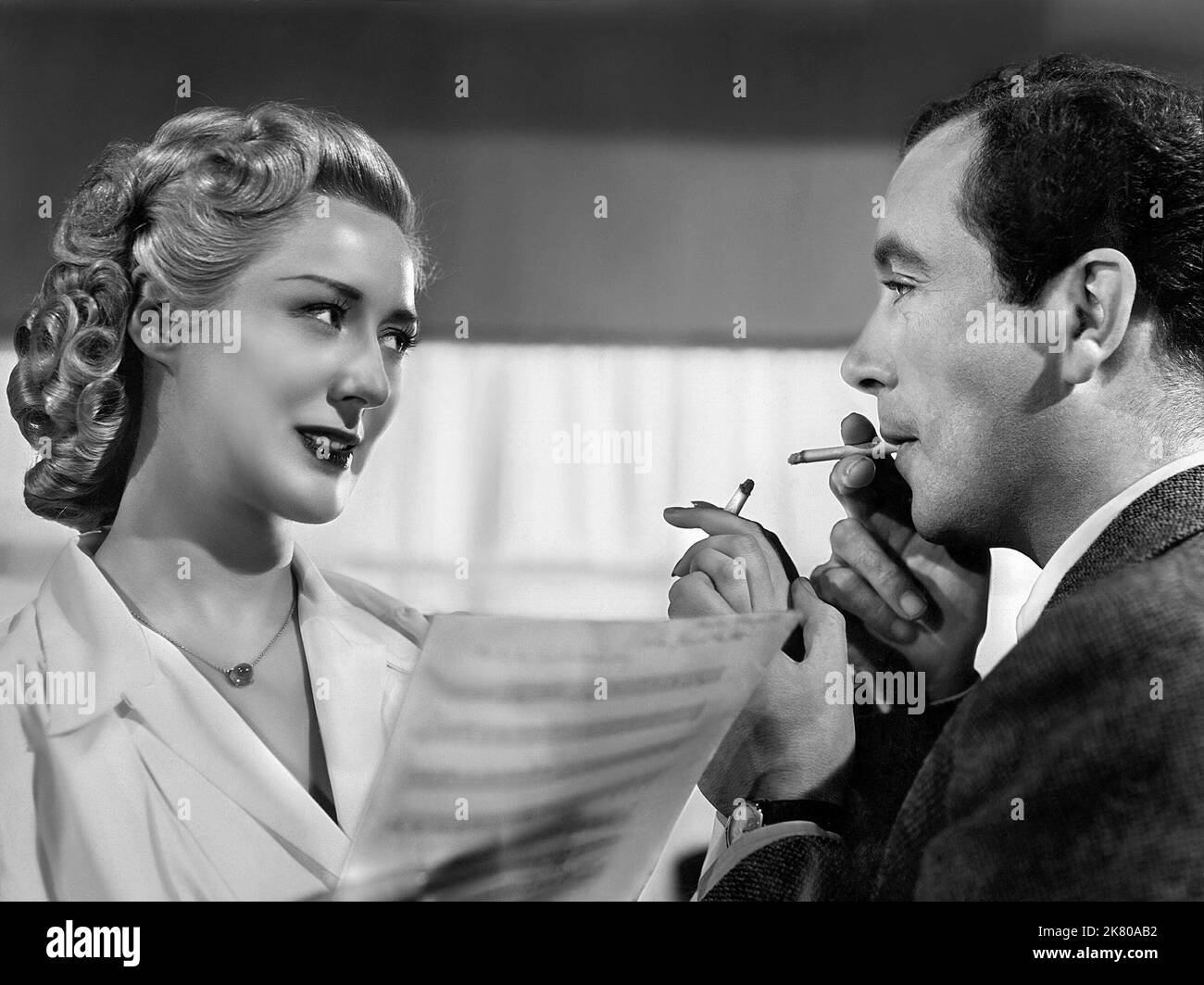 Celia Lipton & Dennis Price Film: The Tall Headlines : The Frightened Bride (1959) Characters: Sandra & Maurice Fletcher  Director: Terence Young 15 April 1952   **WARNING** This Photograph is for editorial use only and is the copyright of BEVERLY PICS and/or the Photographer assigned by the Film or Production Company and can only be reproduced by publications in conjunction with the promotion of the above Film. A Mandatory Credit To BEVERLY PICS is required. The Photographer should also be credited when known. No commercial use can be granted without written authority from the Film Company. Stock Photo