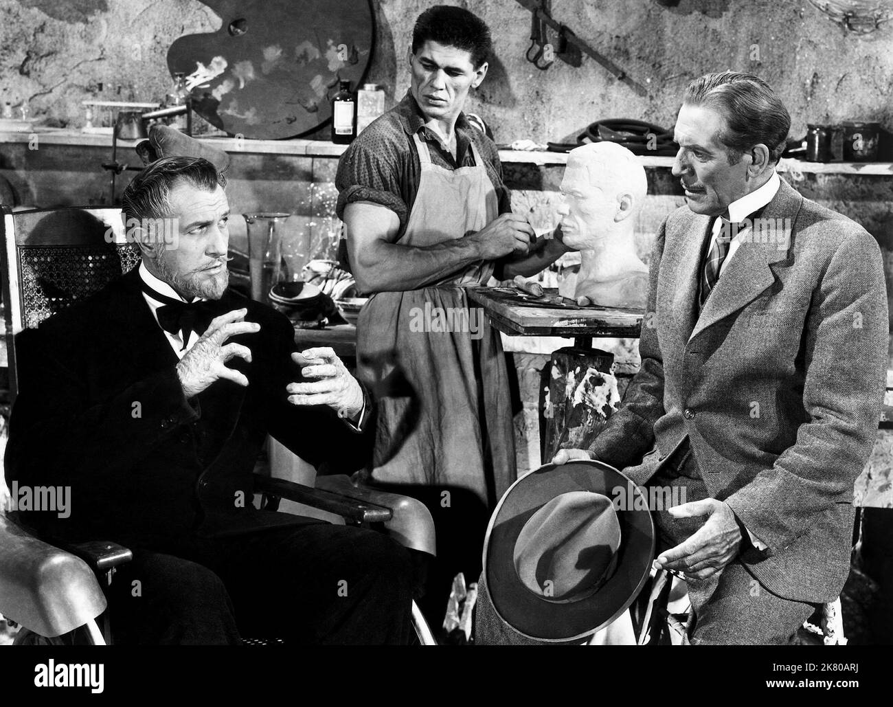 Vincent Price, Charles Bronson & Paul Cavanagh Film: House Of Wax (USA 1953) Characters: Prof. Henry Jarrod,Igor (as Charles Buchinsky) & Sidney Wallace  Director: Andre De Toth 10 April 1953   **WARNING** This Photograph is for editorial use only and is the copyright of WARNER BROS. and/or the Photographer assigned by the Film or Production Company and can only be reproduced by publications in conjunction with the promotion of the above Film. A Mandatory Credit To WARNER BROS. is required. The Photographer should also be credited when known. No commercial use can be granted without written au Stock Photo