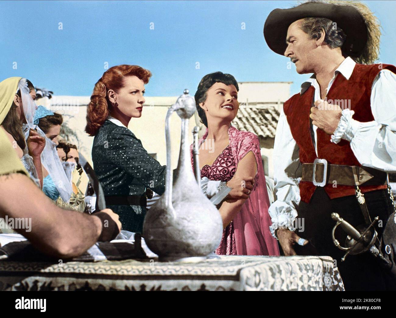 Maureen O'Hara, Alice Kelley & Errol Flynn Film: Against All Flags (USA 1952) Characters: Prudence 'Spitfire' Stevens, Princess Patma, Brian Hawke  Director: George Sherman 21 November 1952   **WARNING** This Photograph is for editorial use only and is the copyright of UNIVERSAL and/or the Photographer assigned by the Film or Production Company and can only be reproduced by publications in conjunction with the promotion of the above Film. A Mandatory Credit To UNIVERSAL is required. The Photographer should also be credited when known. No commercial use can be granted without written authority Stock Photo