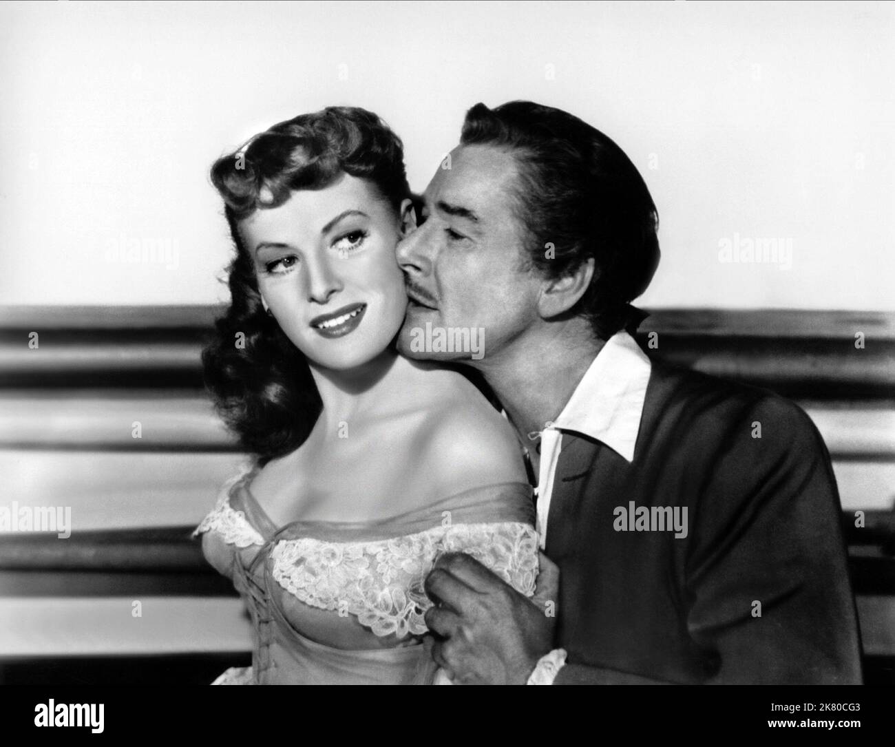 Maureen O'Hara & Errol Flynn Film: Against All Flags (USA 1952) Characters: Prudence 'Spitfire' Stevens, Brian Hawke  Director: George Sherman 21 November 1952   **WARNING** This Photograph is for editorial use only and is the copyright of UNIVERSAL and/or the Photographer assigned by the Film or Production Company and can only be reproduced by publications in conjunction with the promotion of the above Film. A Mandatory Credit To UNIVERSAL is required. The Photographer should also be credited when known. No commercial use can be granted without written authority from the Film Company. Stock Photo