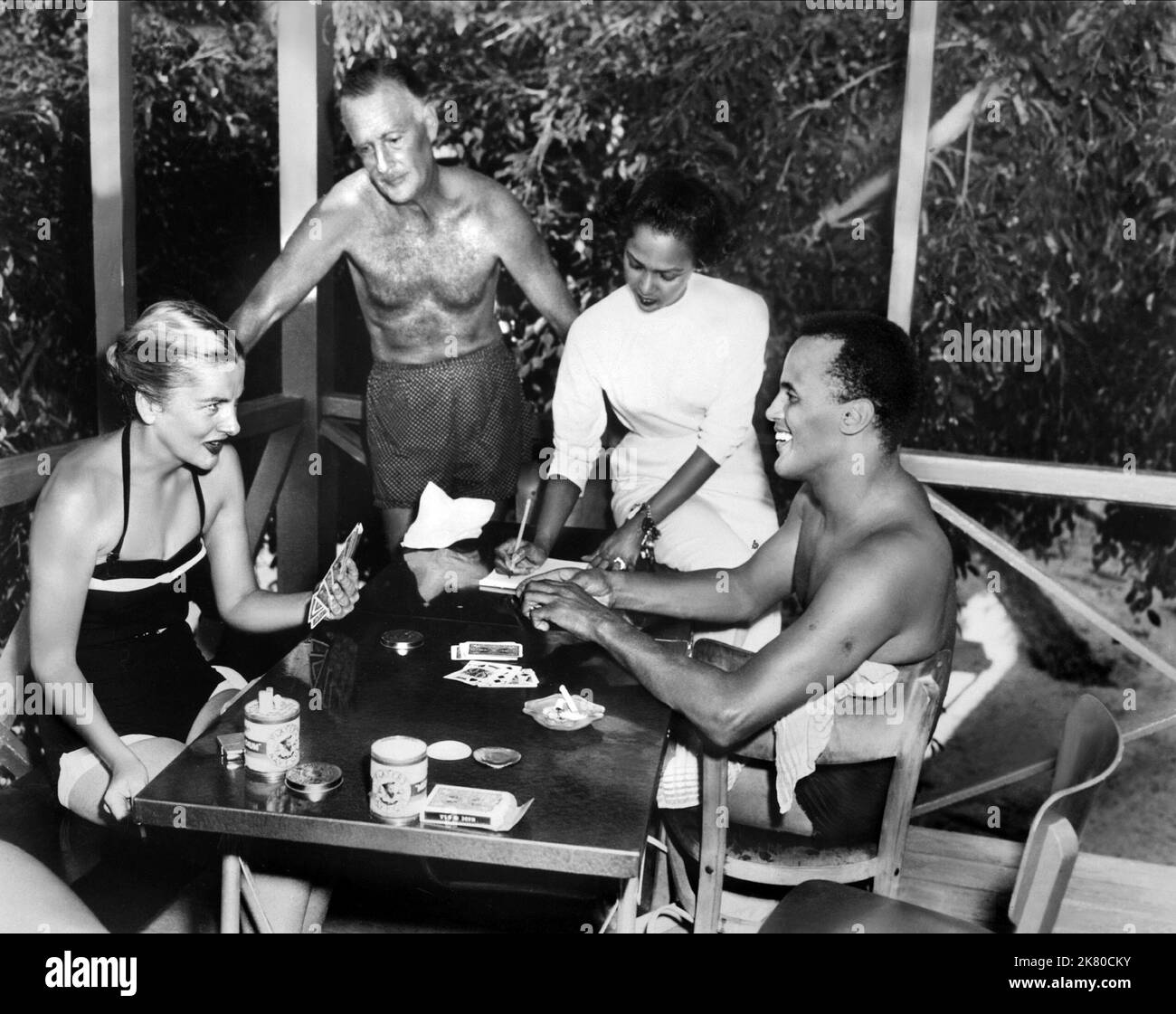 Joan Fontaine, John Williams, Dorothy Dandridge & Harry Belafonte Film: Island In The Sun (1952) Characters: Mavis Norman, Colonel Whittingham, Margot Seaton, David Boyeur  Director: Robert Rossen 12 June 1957   **WARNING** This Photograph is for editorial use only and is the copyright of 20TH CENTURY FOX and/or the Photographer assigned by the Film or Production Company and can only be reproduced by publications in conjunction with the promotion of the above Film. A Mandatory Credit To 20TH CENTURY FOX is required. The Photographer should also be credited when known. No commercial use can be Stock Photo