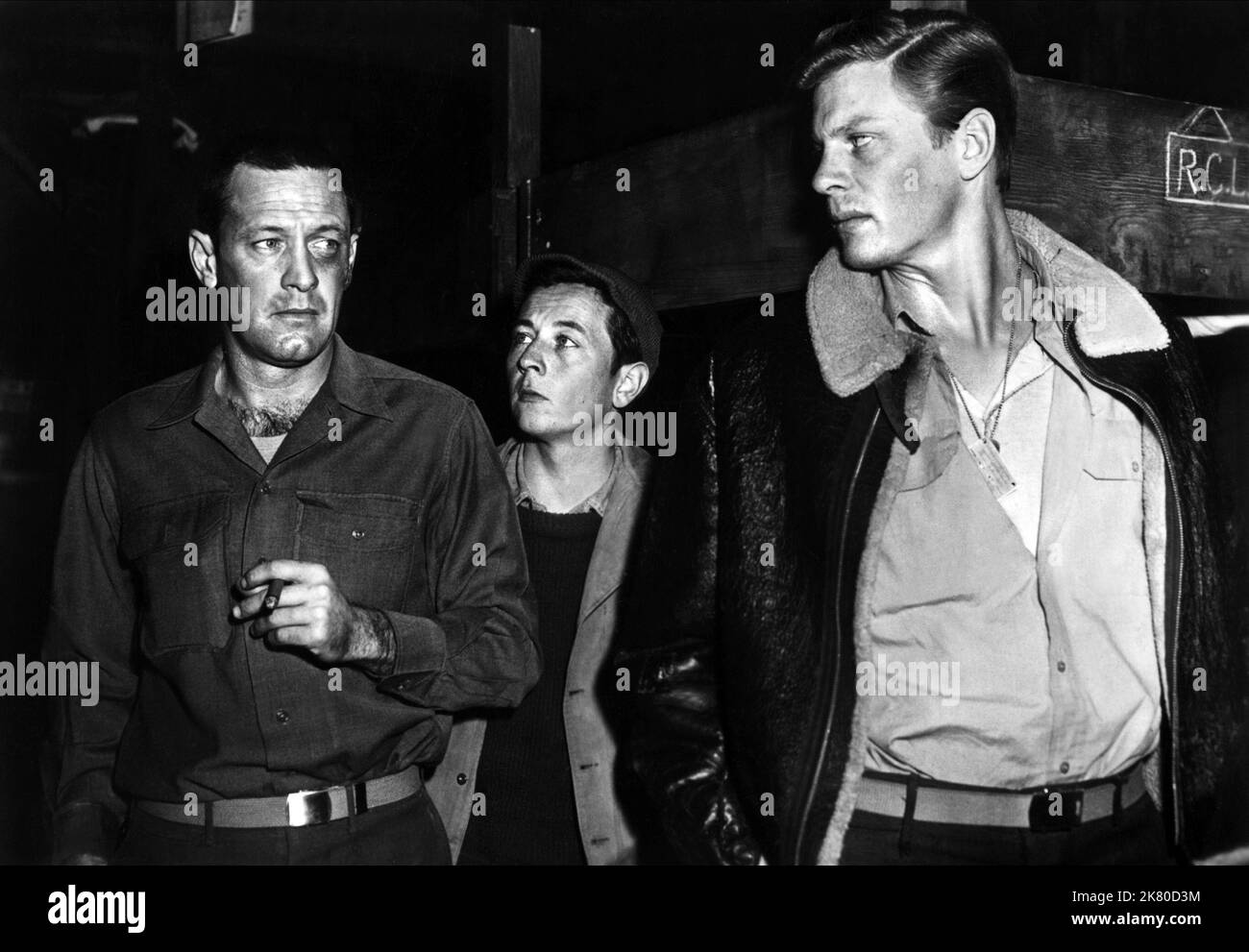 William Holden, Gil Stratton & Peter Graves Film: Stalag 17 (USA 1953) Characters: Sgt. J.J. Sefton, Clarence Harvey 'Cookie' Cook (as Gil Stratton Jr.), Price  Director: Billy Wilder 29 May 1953   **WARNING** This Photograph is for editorial use only and is the copyright of PARAMOUNT and/or the Photographer assigned by the Film or Production Company and can only be reproduced by publications in conjunction with the promotion of the above Film. A Mandatory Credit To PARAMOUNT is required. The Photographer should also be credited when known. No commercial use can be granted without written auth Stock Photo