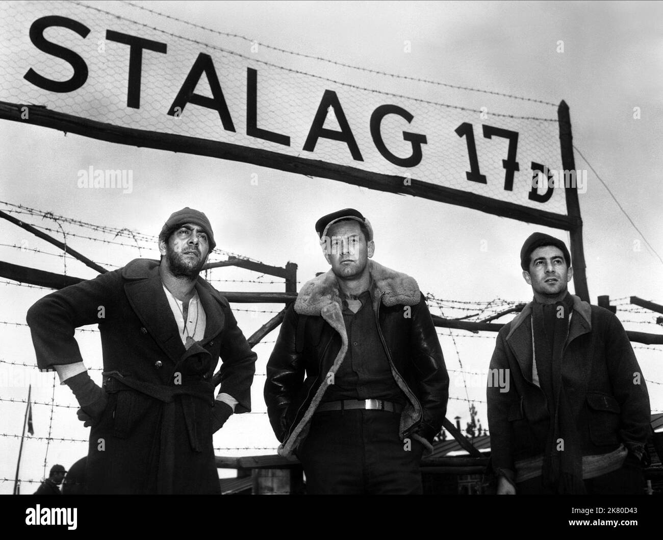 Robert Strauss, William Holden & Harvey Lembeck Film: Stalag 17 (USA 1953) Characters: Stanislas Kasava, Sgt. J.J. Sefton, Harry Shapiro  Director: Billy Wilder 29 May 1953   **WARNING** This Photograph is for editorial use only and is the copyright of PARAMOUNT and/or the Photographer assigned by the Film or Production Company and can only be reproduced by publications in conjunction with the promotion of the above Film. A Mandatory Credit To PARAMOUNT is required. The Photographer should also be credited when known. No commercial use can be granted without written authority from the Film Com Stock Photo