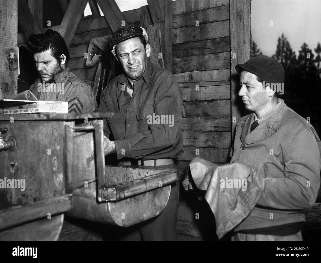 Michael Moore, William Holden & Gil Stratton Film: Stalag 17 (USA 1953) Characters: Manfredi, Sgt. J.J. Sefton, Clarence Harvey 'Cookie' Cook (as Gil Stratton Jr.)  Director: Billy Wilder 29 May 1953   **WARNING** This Photograph is for editorial use only and is the copyright of PARAMOUNT and/or the Photographer assigned by the Film or Production Company and can only be reproduced by publications in conjunction with the promotion of the above Film. A Mandatory Credit To PARAMOUNT is required. The Photographer should also be credited when known. No commercial use can be granted without written Stock Photo