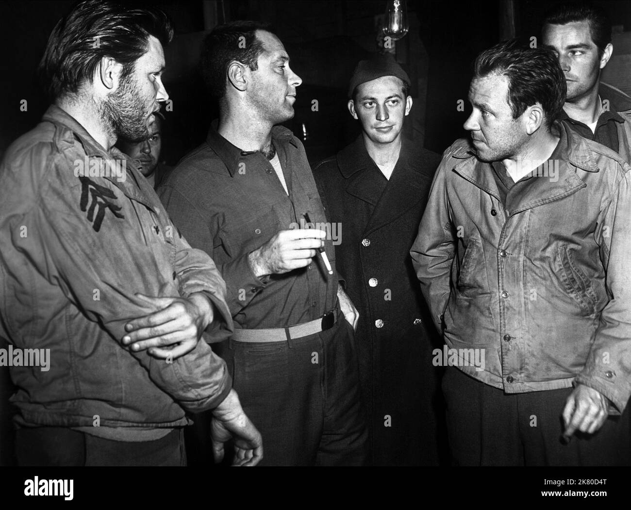 Michael Moore, William Holden & Robert Shawley Film: Stalag 17 (USA 1953) Characters: Manfredi, Sgt. J.J. Sefton, 'Blondie' Peterson  Director: Billy Wilder 29 May 1953   **WARNING** This Photograph is for editorial use only and is the copyright of PARAMOUNT and/or the Photographer assigned by the Film or Production Company and can only be reproduced by publications in conjunction with the promotion of the above Film. A Mandatory Credit To PARAMOUNT is required. The Photographer should also be credited when known. No commercial use can be granted without written authority from the Film Company Stock Photo