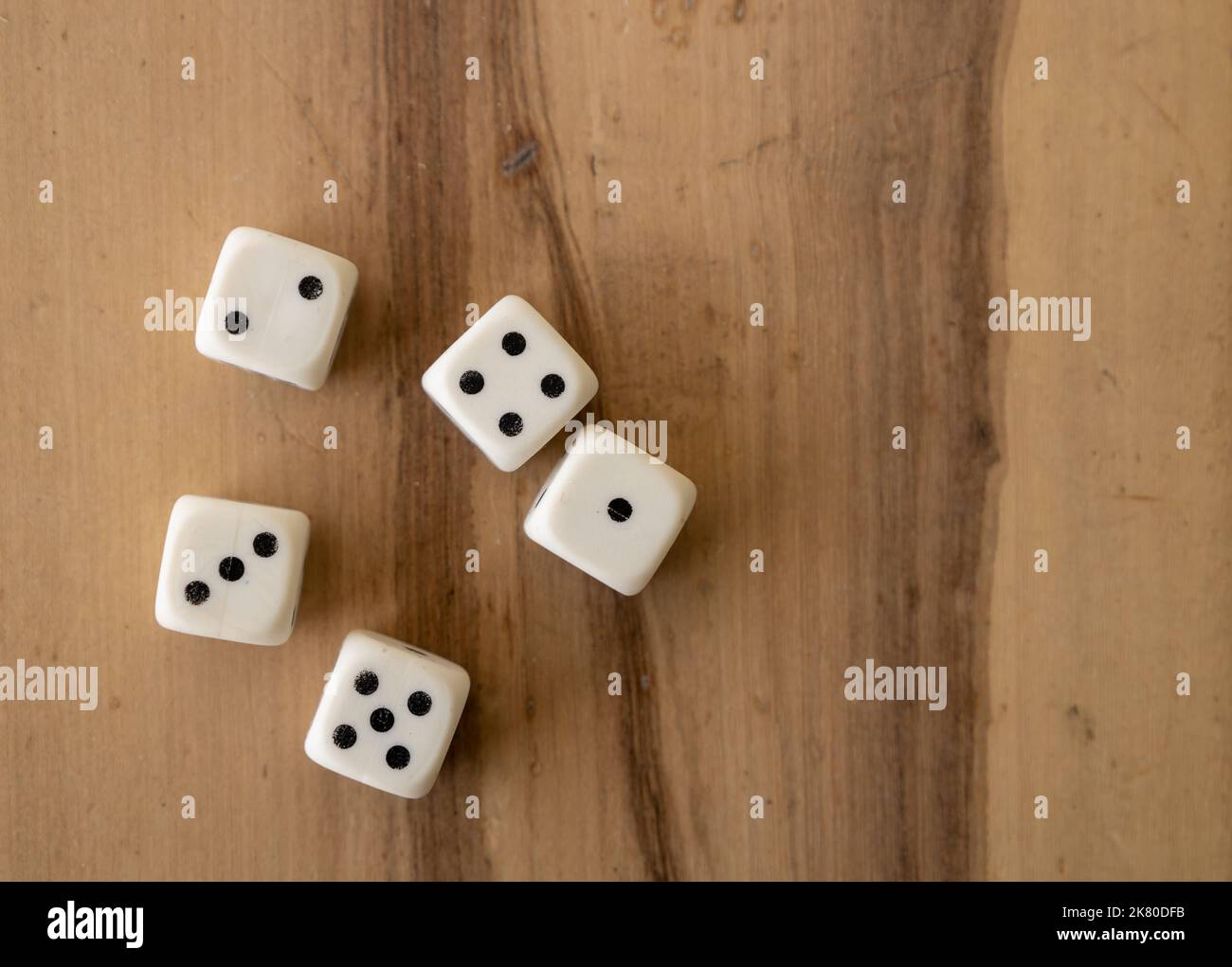Numbered plastic pieces. Board game called dice Stock Photo Alamy