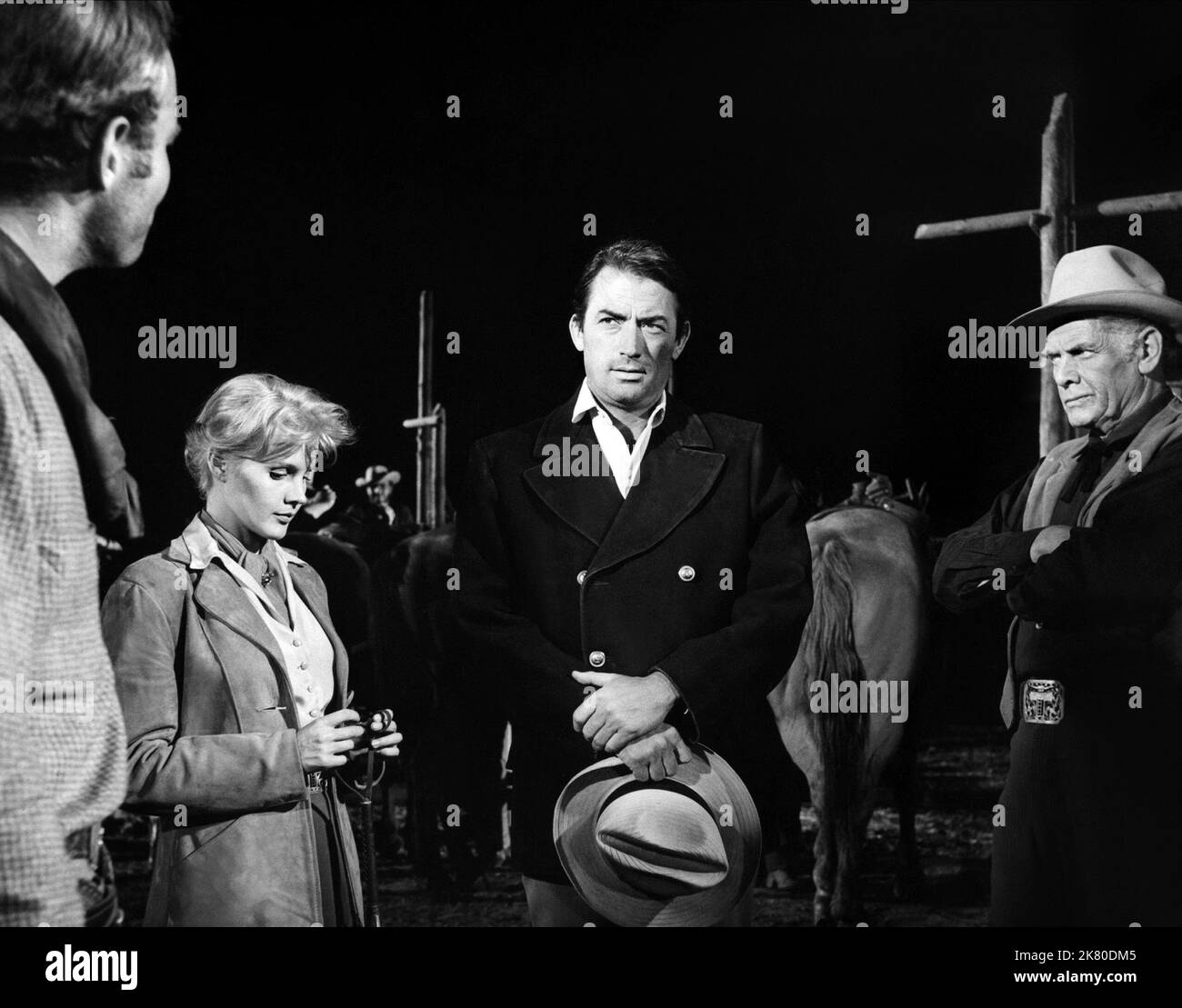 Charlton Heston, Carroll Baker, Gregory Peck & Charles Bickford Film: The Big Country (USA 1958) Characters: Steve Leech, Patricia Terrill, James McKay, Maj. Henry Terrill  Director: William Wyler 13 August 1958   **WARNING** This Photograph is for editorial use only and is the copyright of UNITED ARTISTS and/or the Photographer assigned by the Film or Production Company and can only be reproduced by publications in conjunction with the promotion of the above Film. A Mandatory Credit To UNITED ARTISTS is required. The Photographer should also be credited when known. No commercial use can be gr Stock Photo