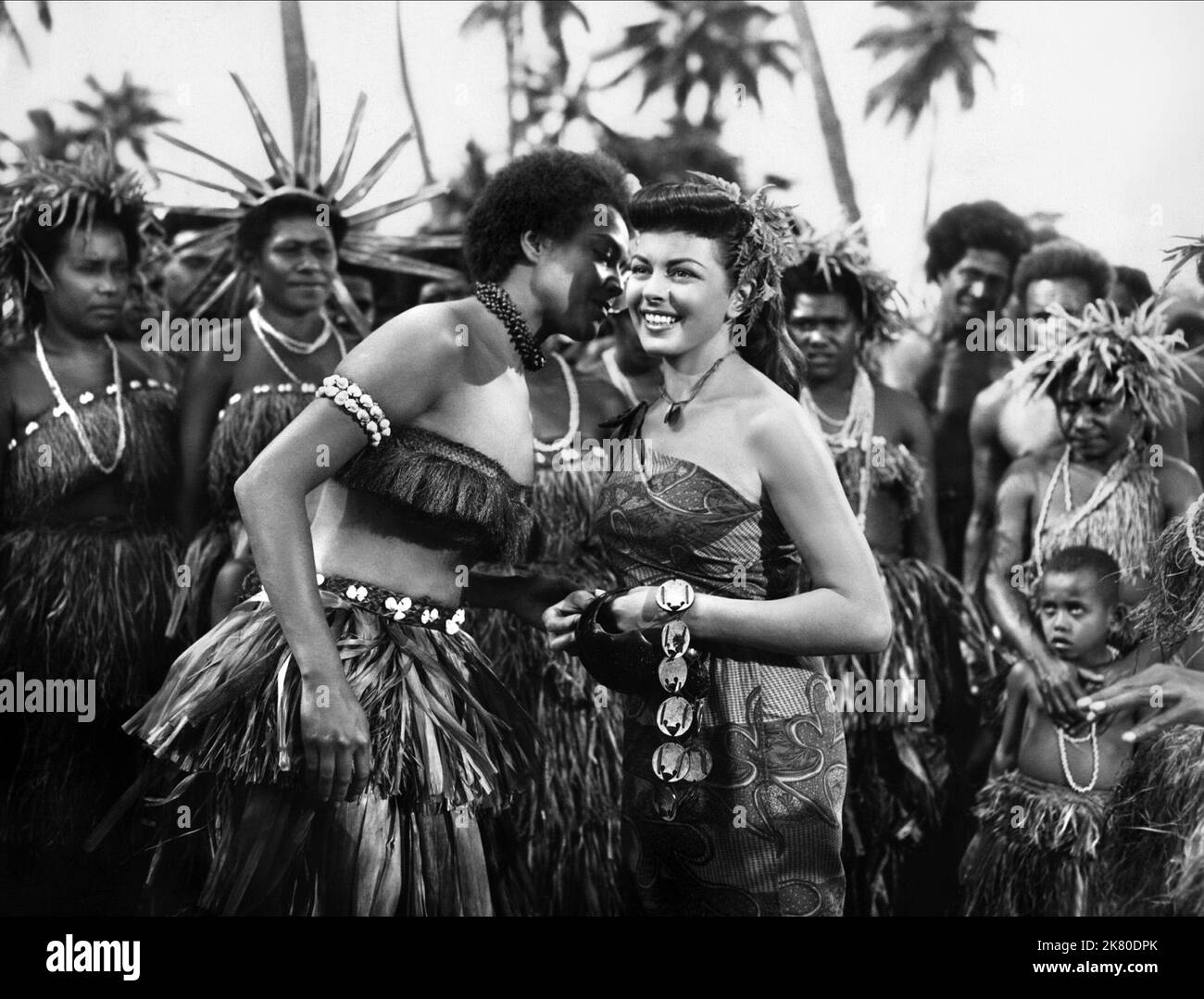 Tessa Prendergast & Joan Rice Film: His Majesty O'Keefe (1954) Characters: Kakofel, Dalabo aki Dali  Director: Byron Haskin 16 January 1954   **WARNING** This Photograph is for editorial use only and is the copyright of WARNER BROS and/or the Photographer assigned by the Film or Production Company and can only be reproduced by publications in conjunction with the promotion of the above Film. A Mandatory Credit To WARNER BROS is required. The Photographer should also be credited when known. No commercial use can be granted without written authority from the Film Company. Stock Photo